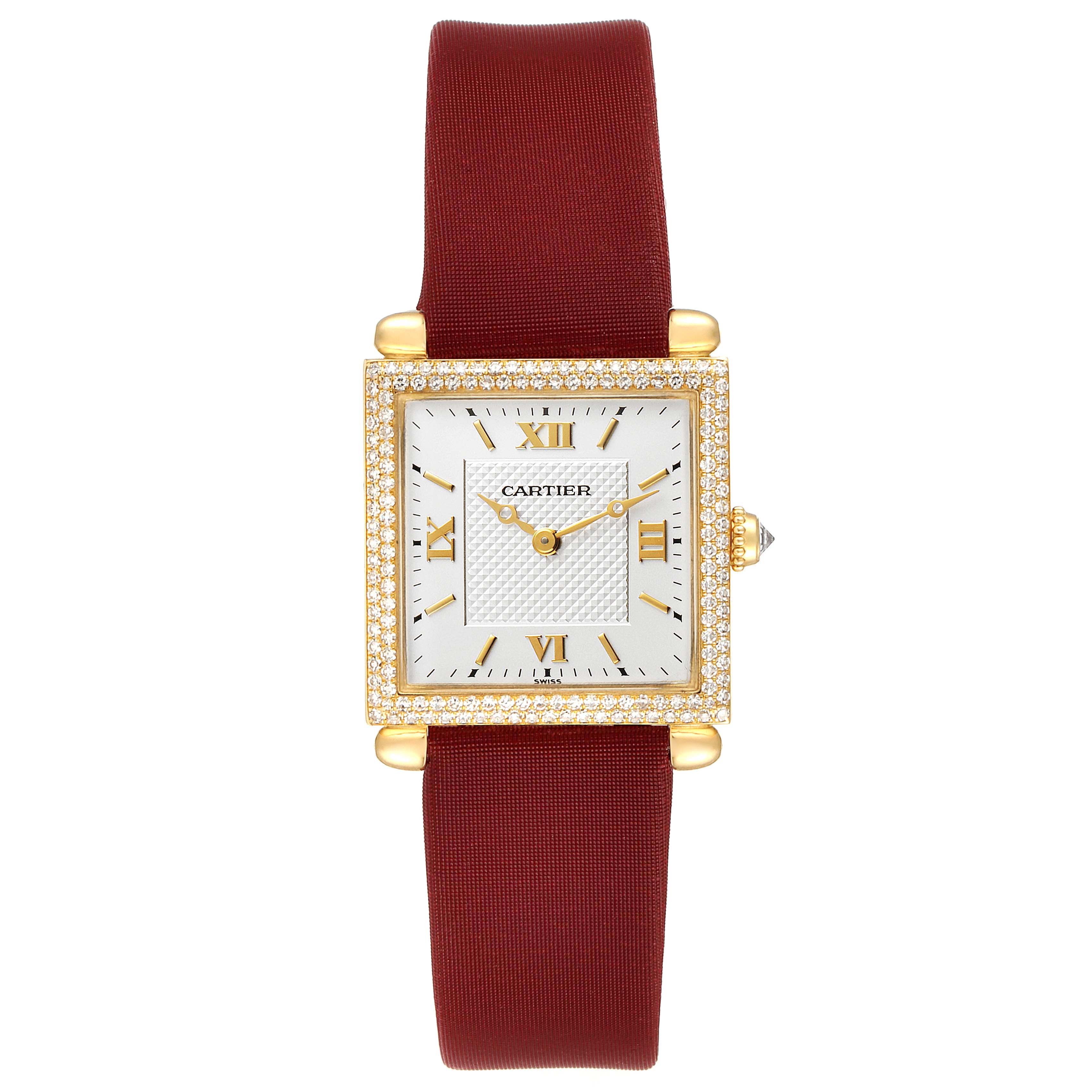 The Cartier Tank Obus WB800351  Women's Yellow Gold Silver Dial WB800351  Women's Yellow Gold Silver Dial watch is shown from a front angle, displaying its dial, case, and burgundy strap.