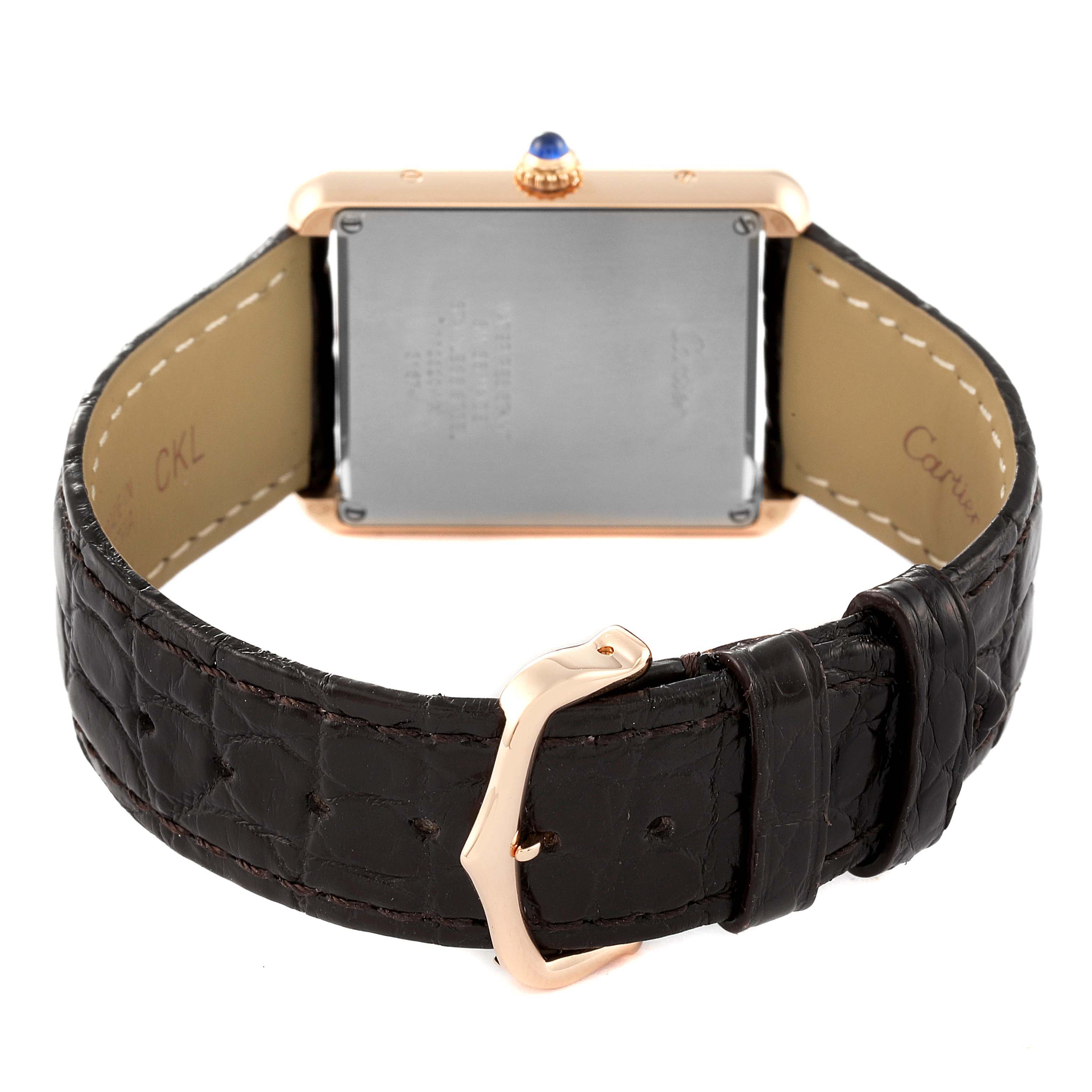 The image shows the back view of a Cartier Tank Solo W5200025 Men
s Rose Gold Silver Dial W5200025 Men
s Rose Gold Silver Dial watch, highlighting its buckle, strap, and case back.