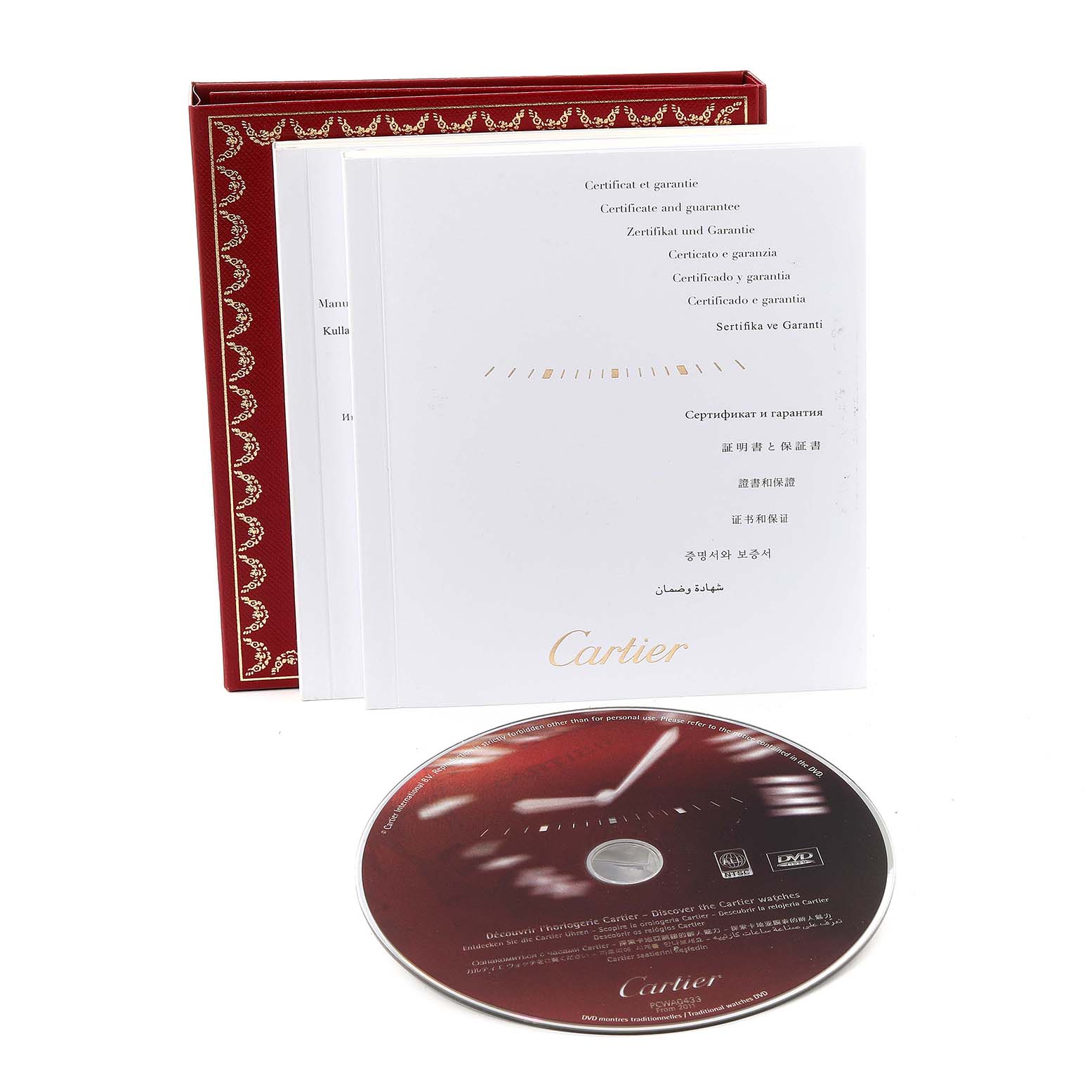 This image shows the warranty booklet and a DVD for the Cartier Tank Solo W5200004 Men
s Yellow Gold Silver Dial W5200004 Men
s Yellow Gold Silver Dial watch model.