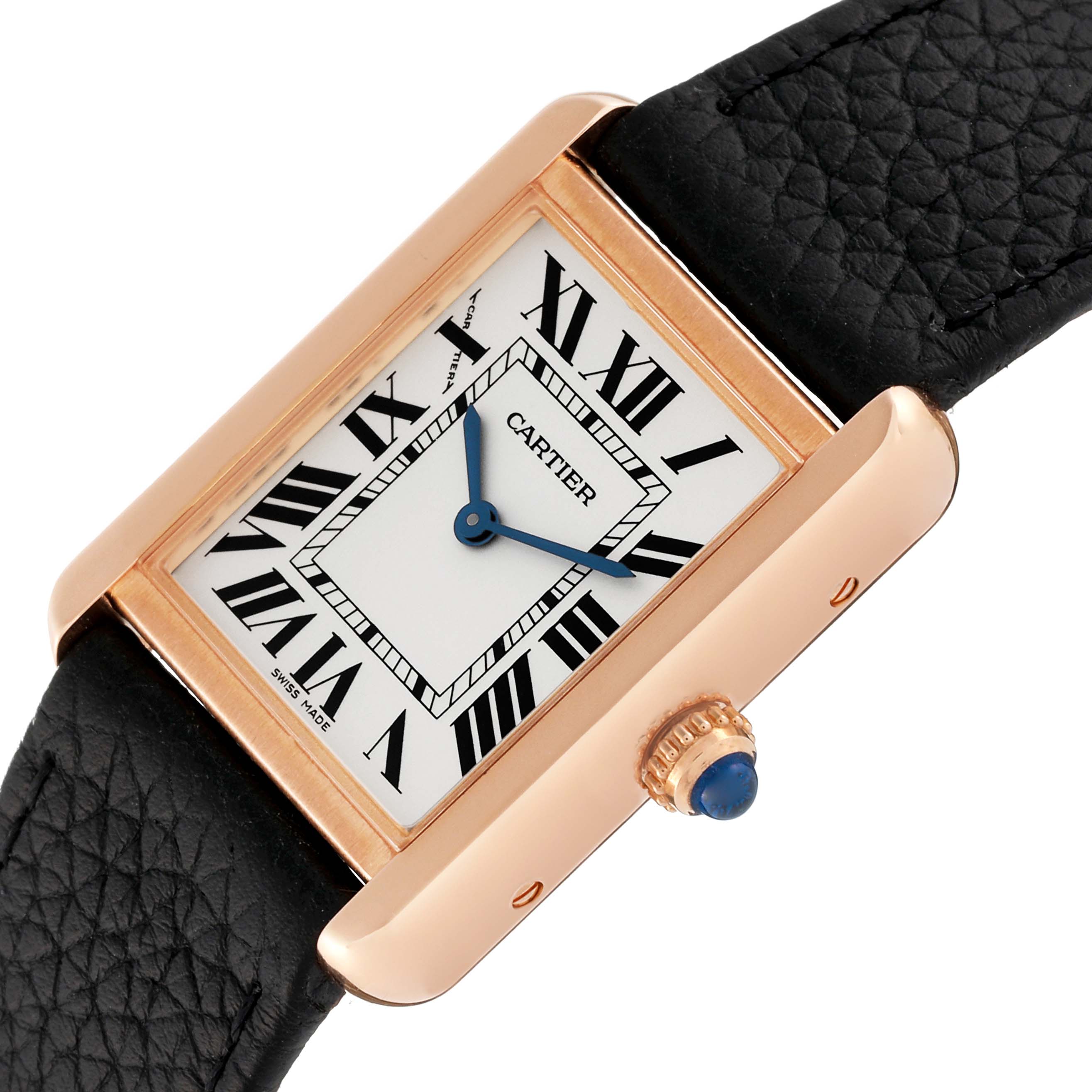 The image shows a close-up angle of the Cartier Tank Solo W5200024 Women's Rose Gold Silver Dial W5200024 Women's Rose Gold Silver Dial watch, highlighting its face, Roman numerals, and crown with a blue cabochon.