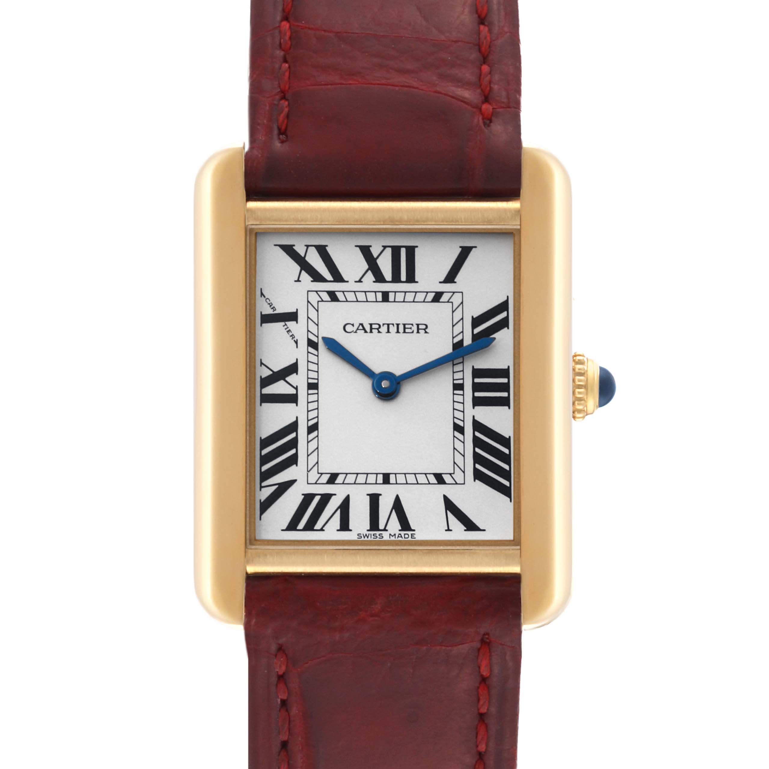 The image shows a front view of the Cartier Tank Solo W5200002 Women's Steel and Gold (two tone) Silver Dial W5200002 Women's Steel and Gold (two tone) Silver Dial watch with a gold rectangular case, Roman numeral dial, and red leather strap.