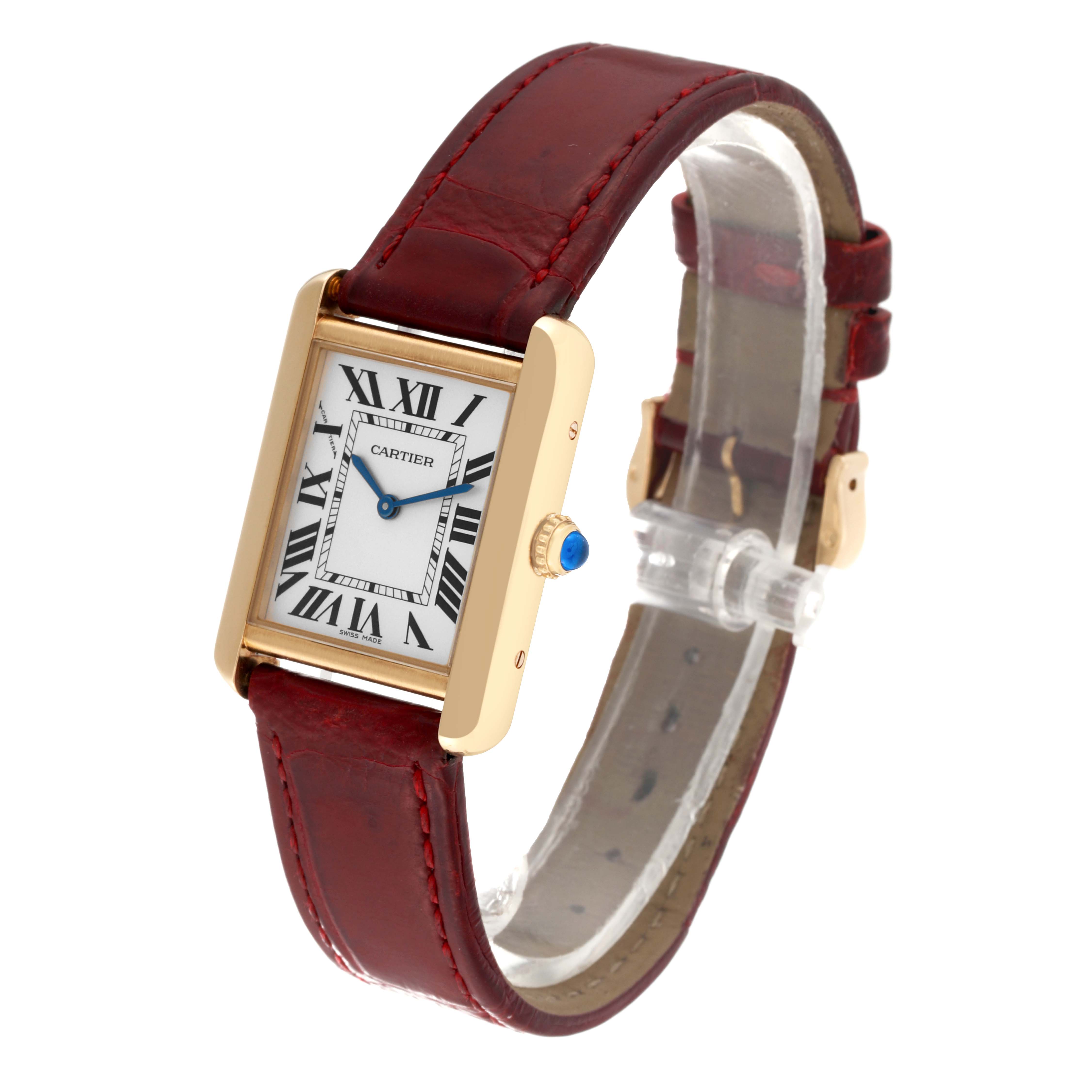 The Cartier Tank Solo W5200002 Women's Steel and Gold (two tone) Silver Dial W5200002 Women's Steel and Gold (two tone) Silver Dial watch is shown at an oblique angle, displaying the dial, case, strap, and crown with a blue gem.