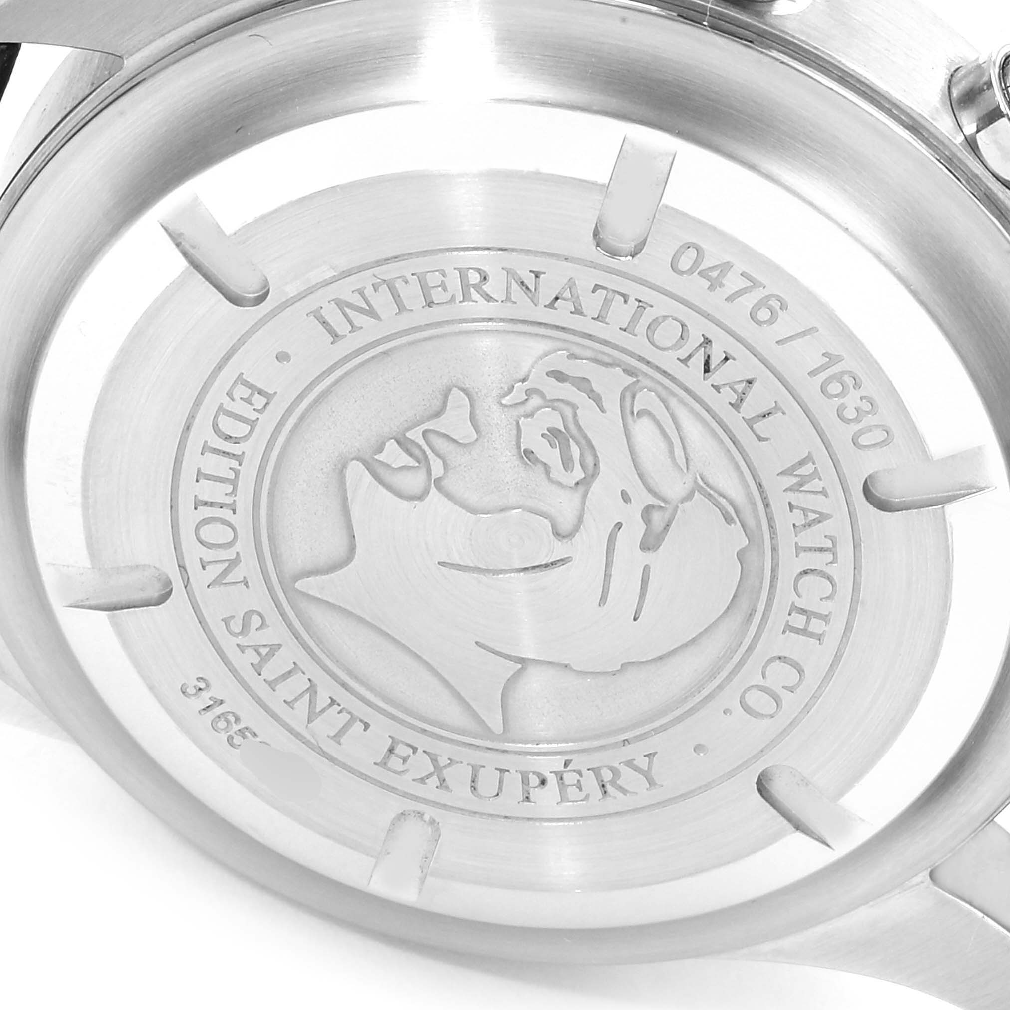 This image shows the engraved back case of an IWC Pilot IW371709 Men's Stainless Steel Brown Dial IW371709 Men's Stainless Steel Brown Dial model, Edition Saint Exupéry, featuring inscription details.