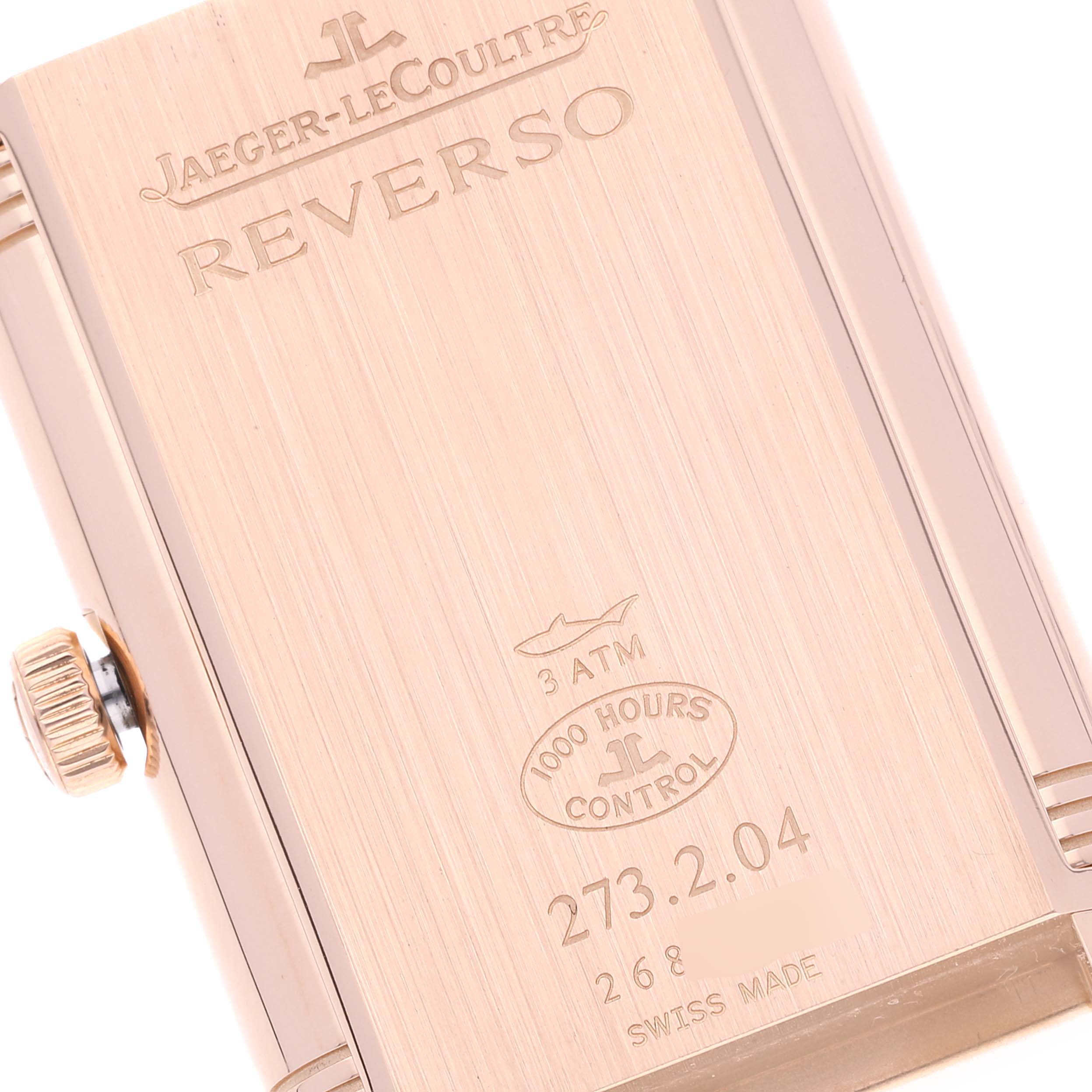 This image shows the back case of a Jaeger-LeCoultre Reverso watch, highlighting brand engravings and specifications.