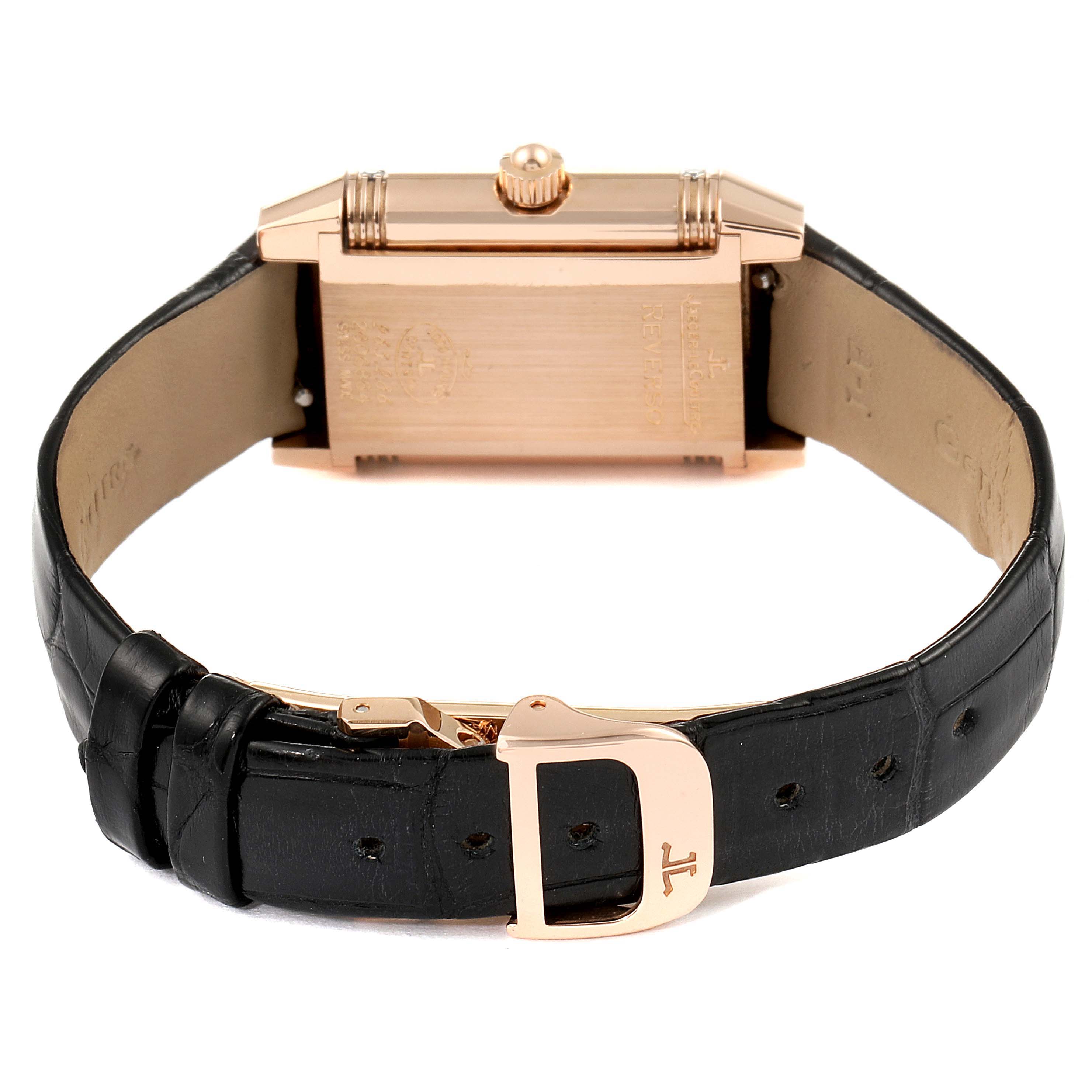 This image shows the back of the watch and the leather strap with a gold clasp of the Jaeger-LeCoultre Reverso model.