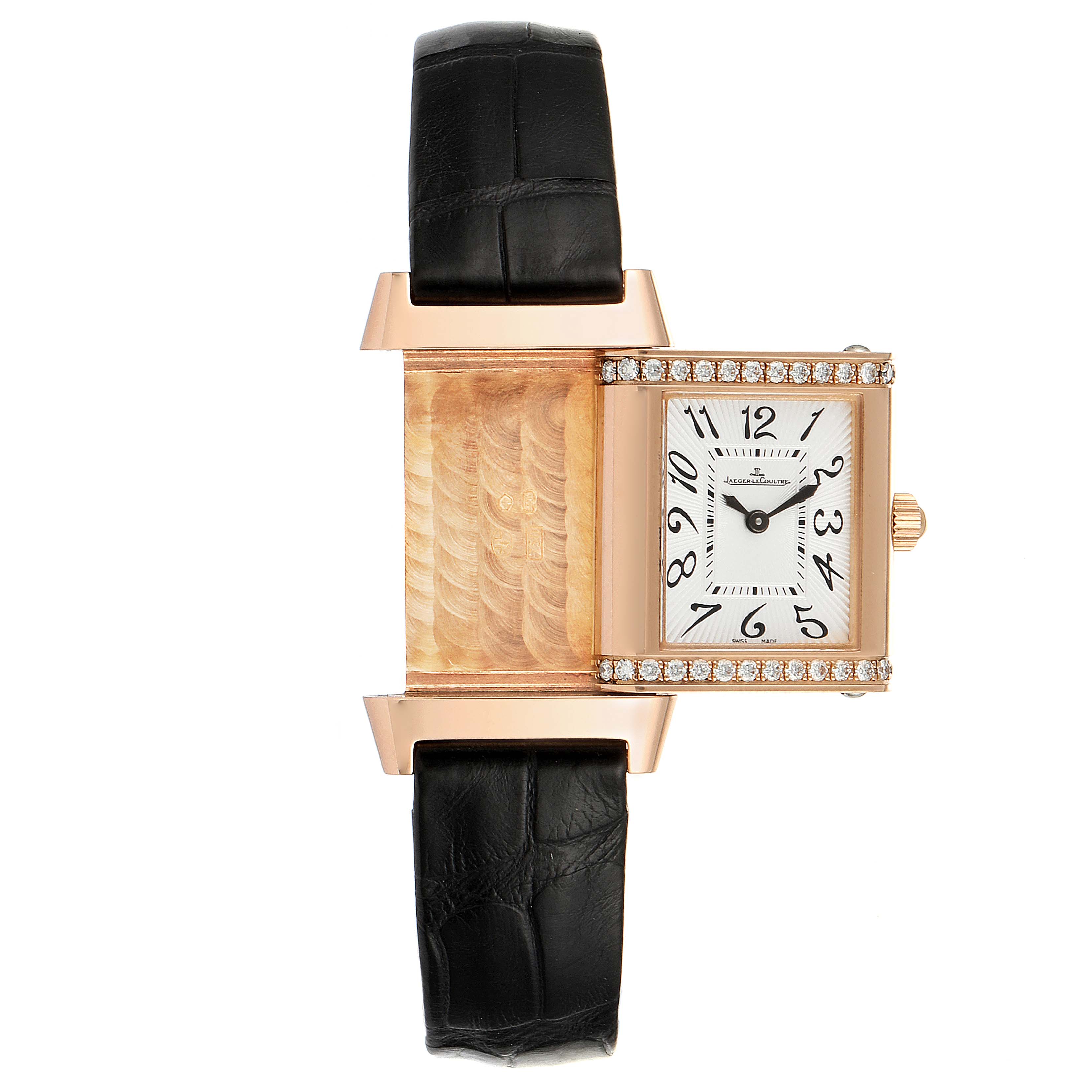 The image shows the Jaeger-LeCoultre Reverso watch with its case partially separated, revealing the decorative reverse side.