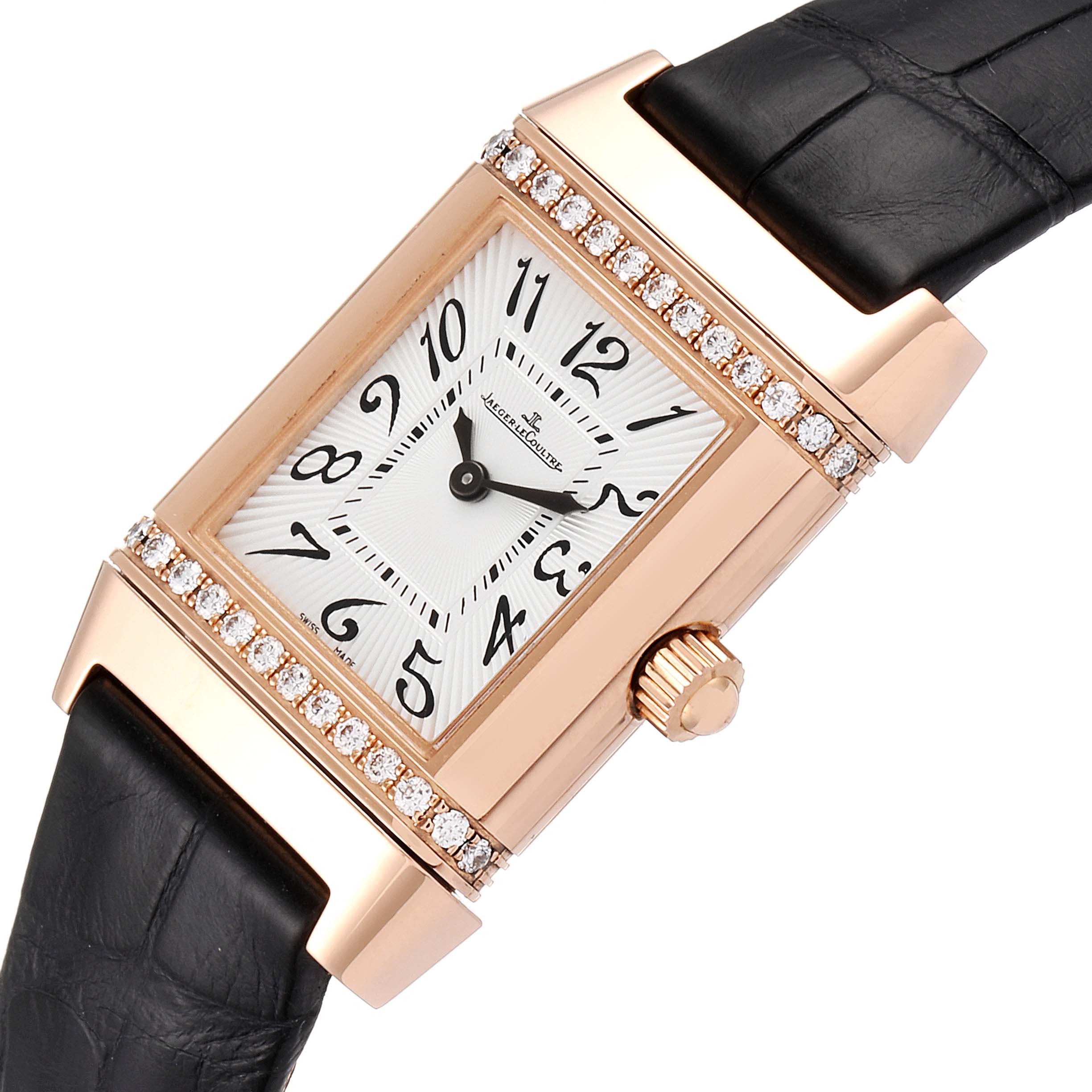This image shows a Jaeger-LeCoultre Reverso watch at a three-quarter angle, highlighting the face, crown, and strap.