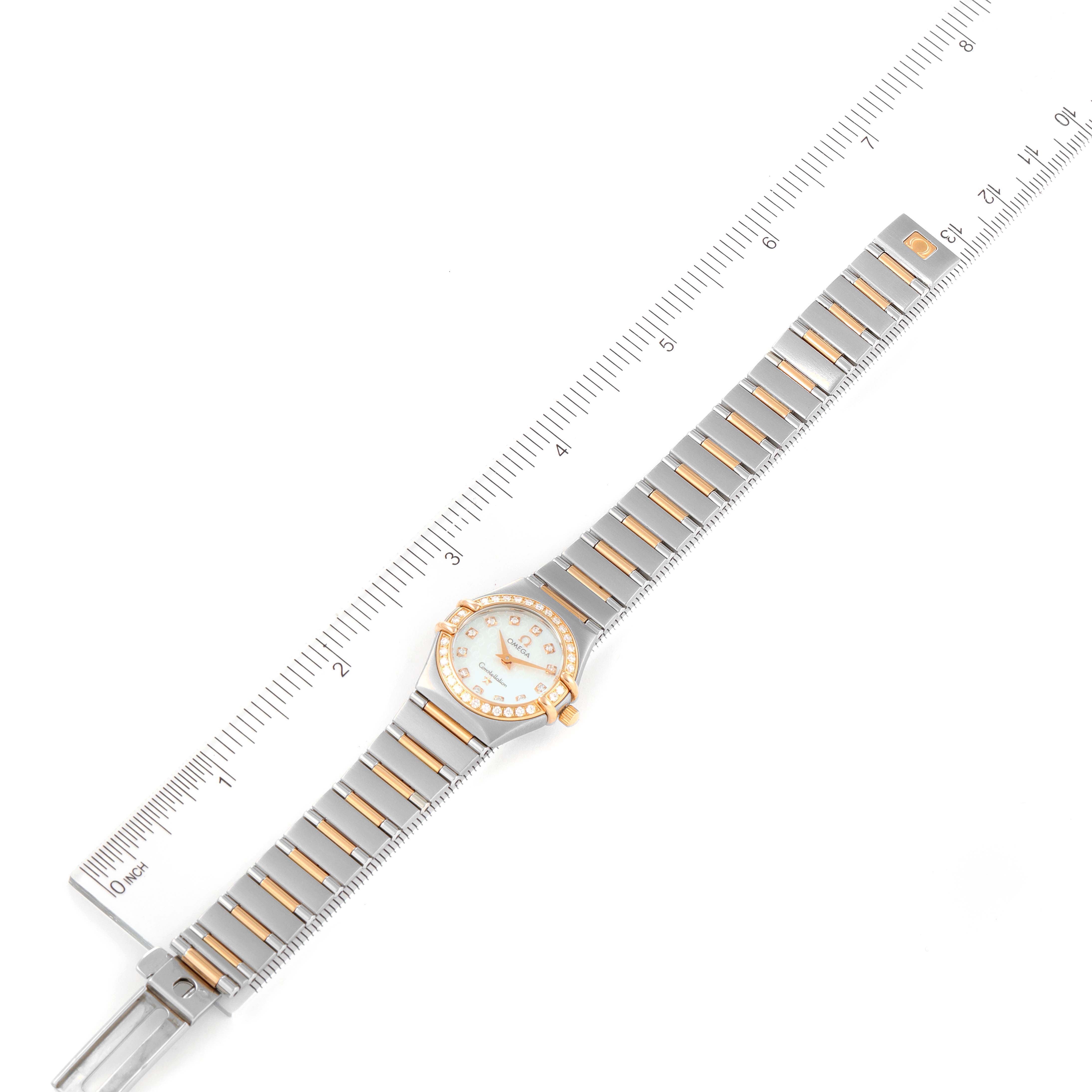 The image shows the Omega 1360.75.00 Women's Steel and Gold (two tone) Mother of Pearl Dial 1360.75.00 Women's Steel and Gold (two tone) Mother of Pearl Dial Constellation My Choice Steel Rose Gold Diamond Ladies Watch 1360.75.00 laid flat, with the watch bracelet extended and a ruler for measurement.