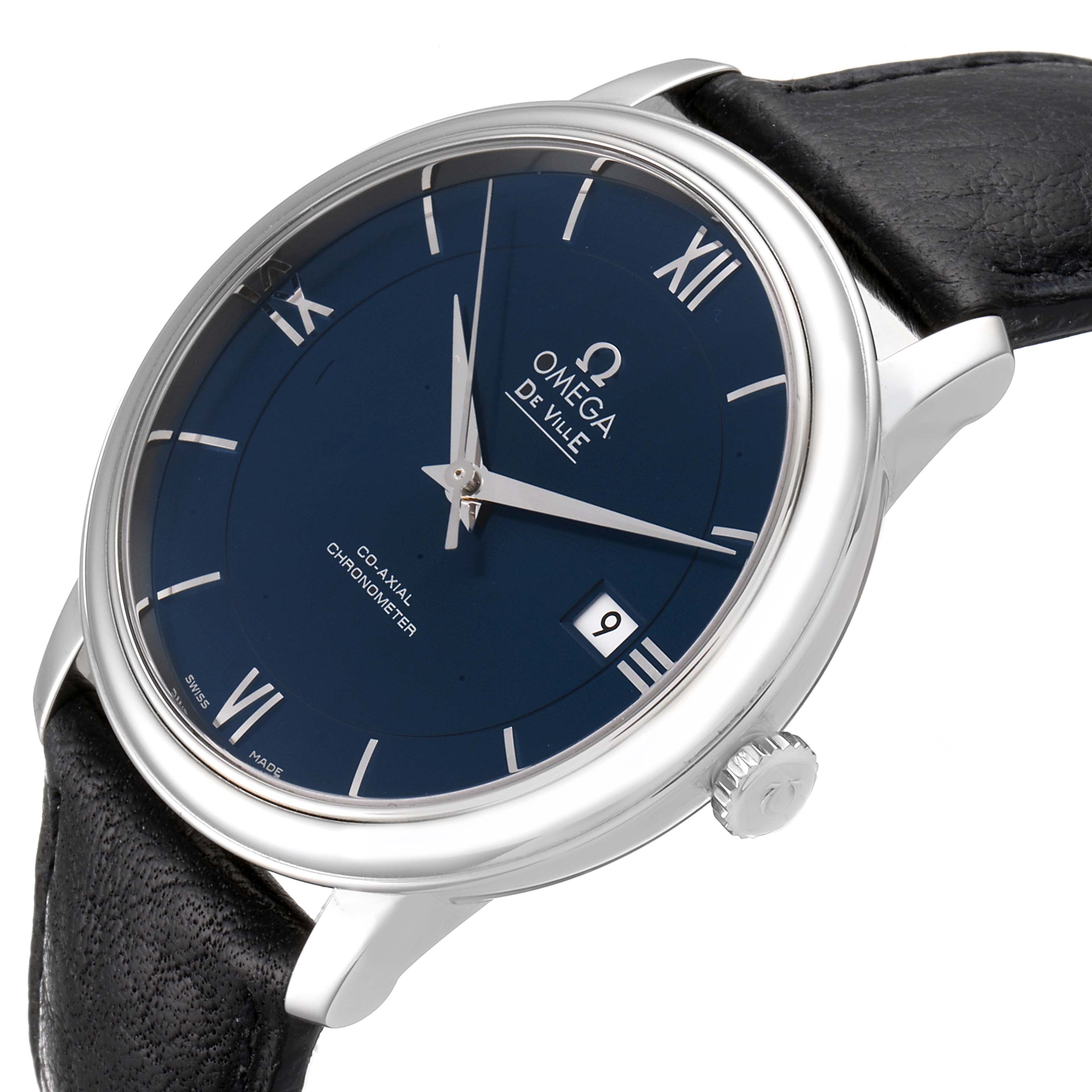 The De Ville model by Omega watch is shown at an oblique angle, highlighting the face, crown, and black leather strap.