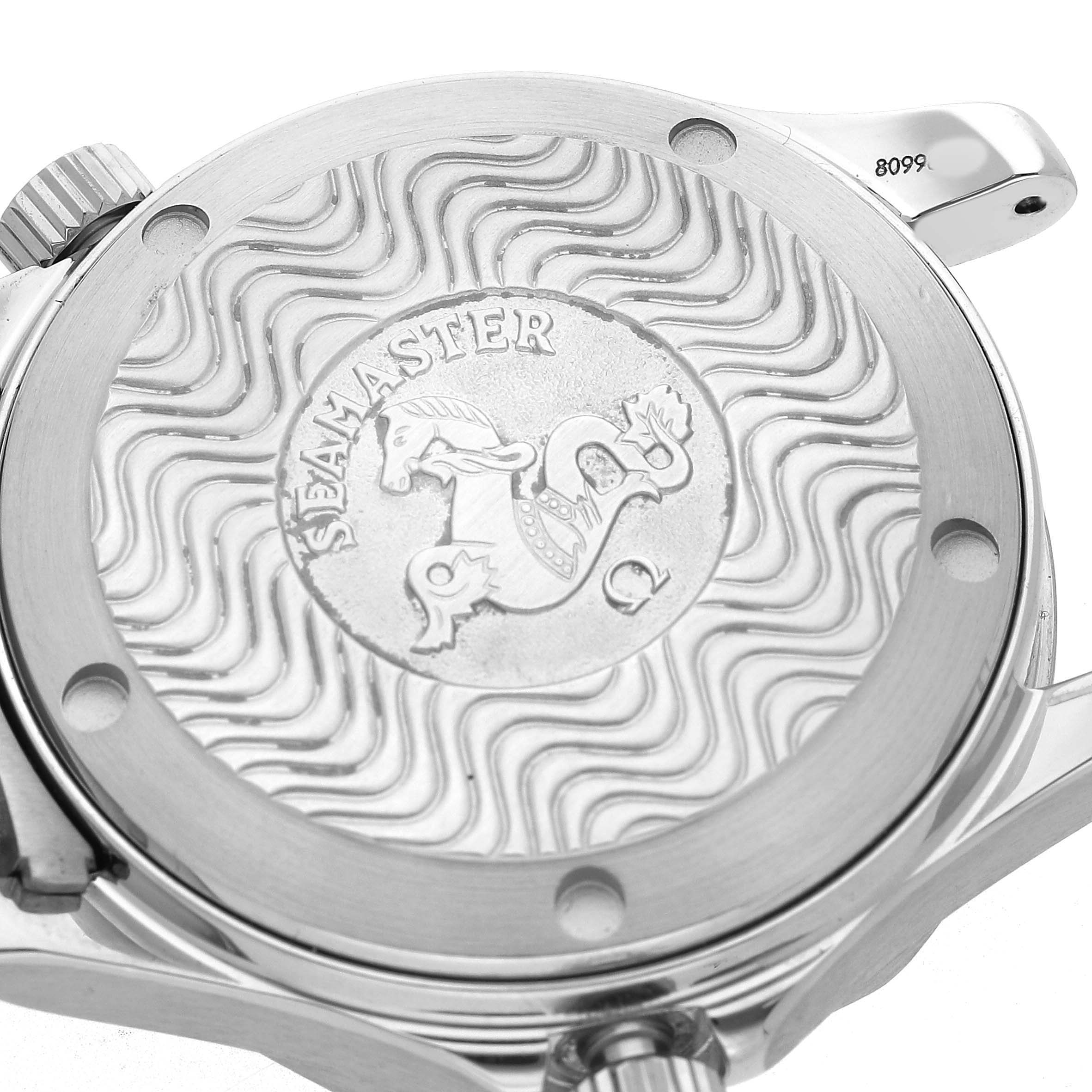 The image shows the back case of the Omega Seamaster 2551.80.00 Men's Stainless Steel Blue Dial watch featuring engraved wave patterns and a central emblem.