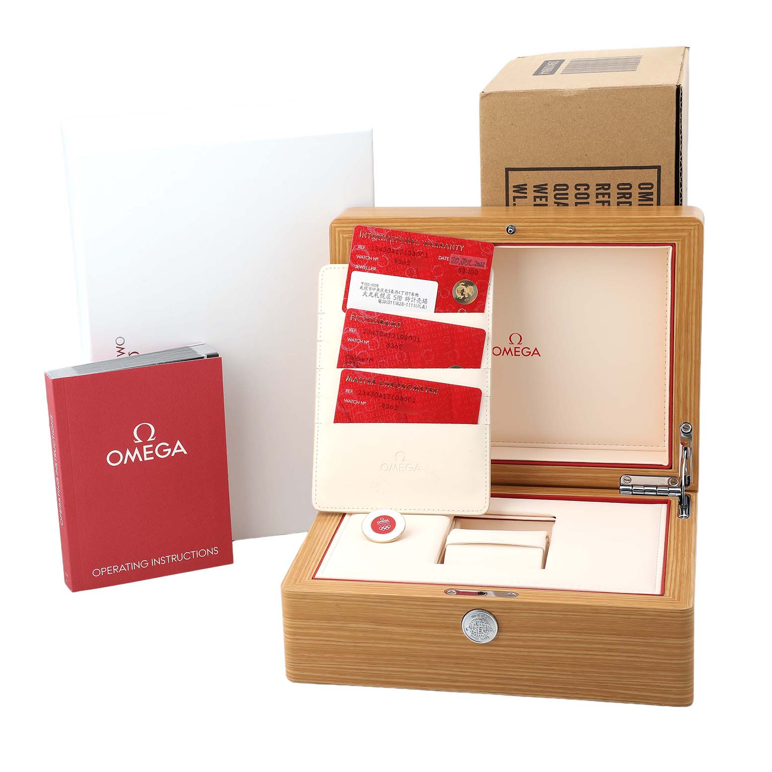 The image shows the packaging and accessories of an Omega Seamaster 234.30.41.21.03.001 Men's Stainless Steel Blue Dial, including a box, manuals, and cards.