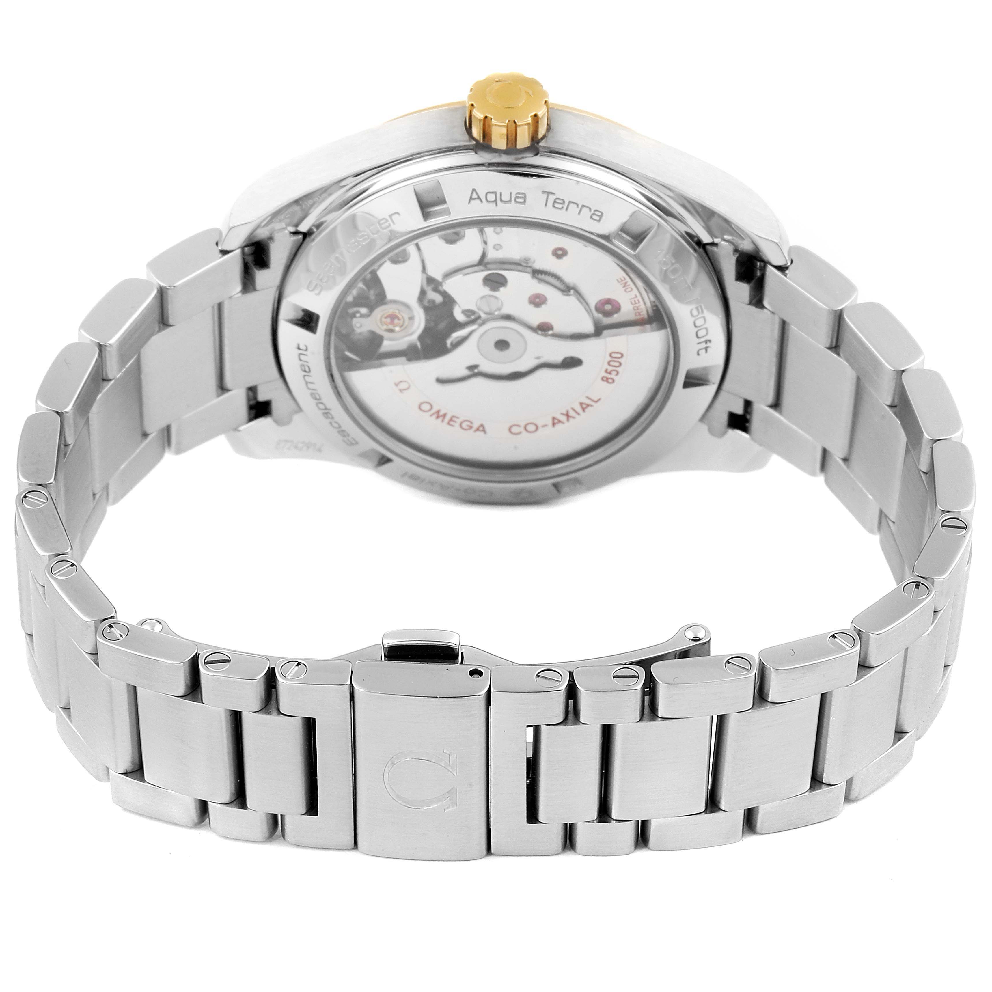 The image shows the back view of the Omega Aqua Terra 231.20.39.21.06.004 Men
s Steel and Gold (two tone) Grey Dial 231.20.39.21.06.004 Men
s Steel and Gold (two tone) Grey Dial watch, highlighting the clasp, bracelet, and visible movement mechanism.