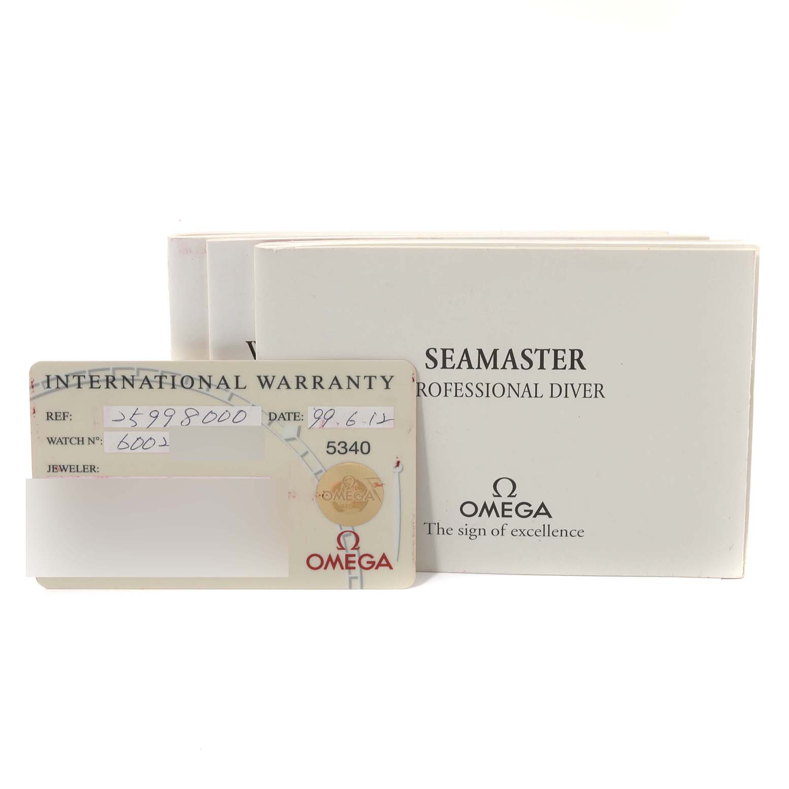 The image shows the warranty card and the box of an Omega Seamaster 2599.80.00 Men's Stainless Steel Blue Dial 2599.80.00 Men's Stainless Steel Blue Dial Professional Diver watch.