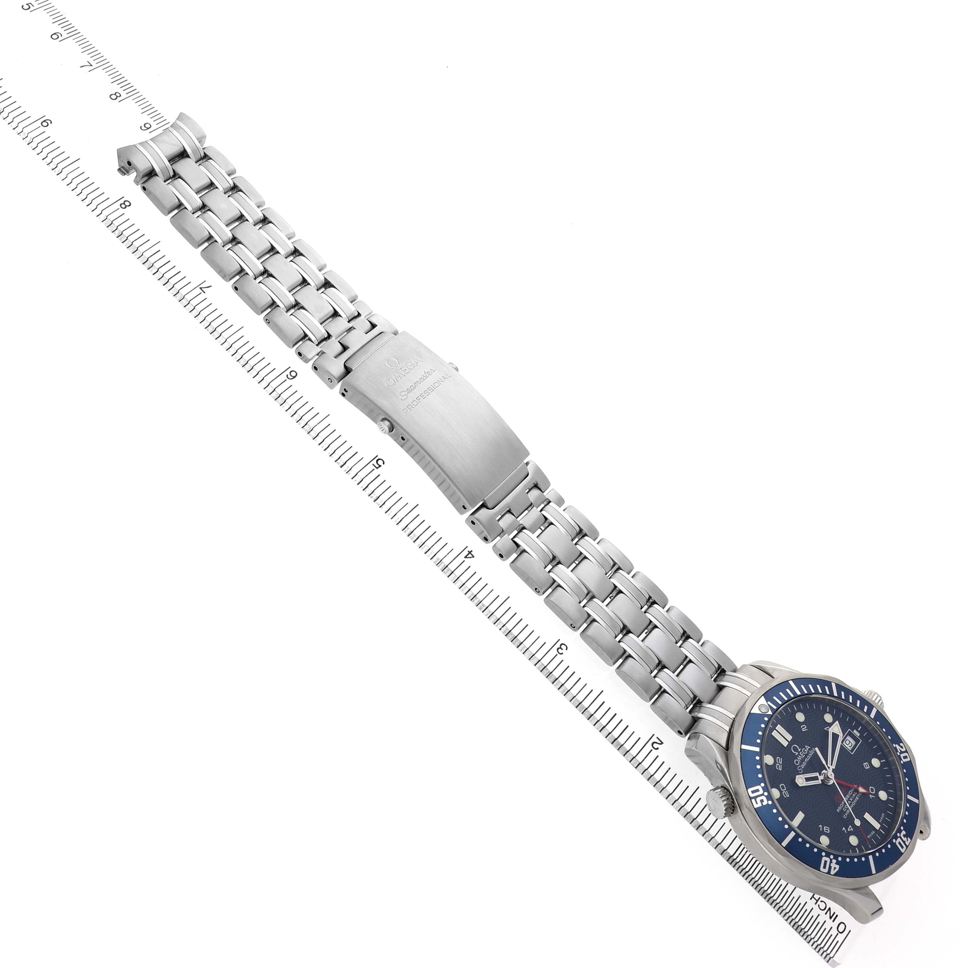 The Omega Seamaster 2535.80.00 Men's Stainless Steel Blue Dial watch is shown from a top-down angle, featuring the dial and stainless steel bracelet alongside a ruler.