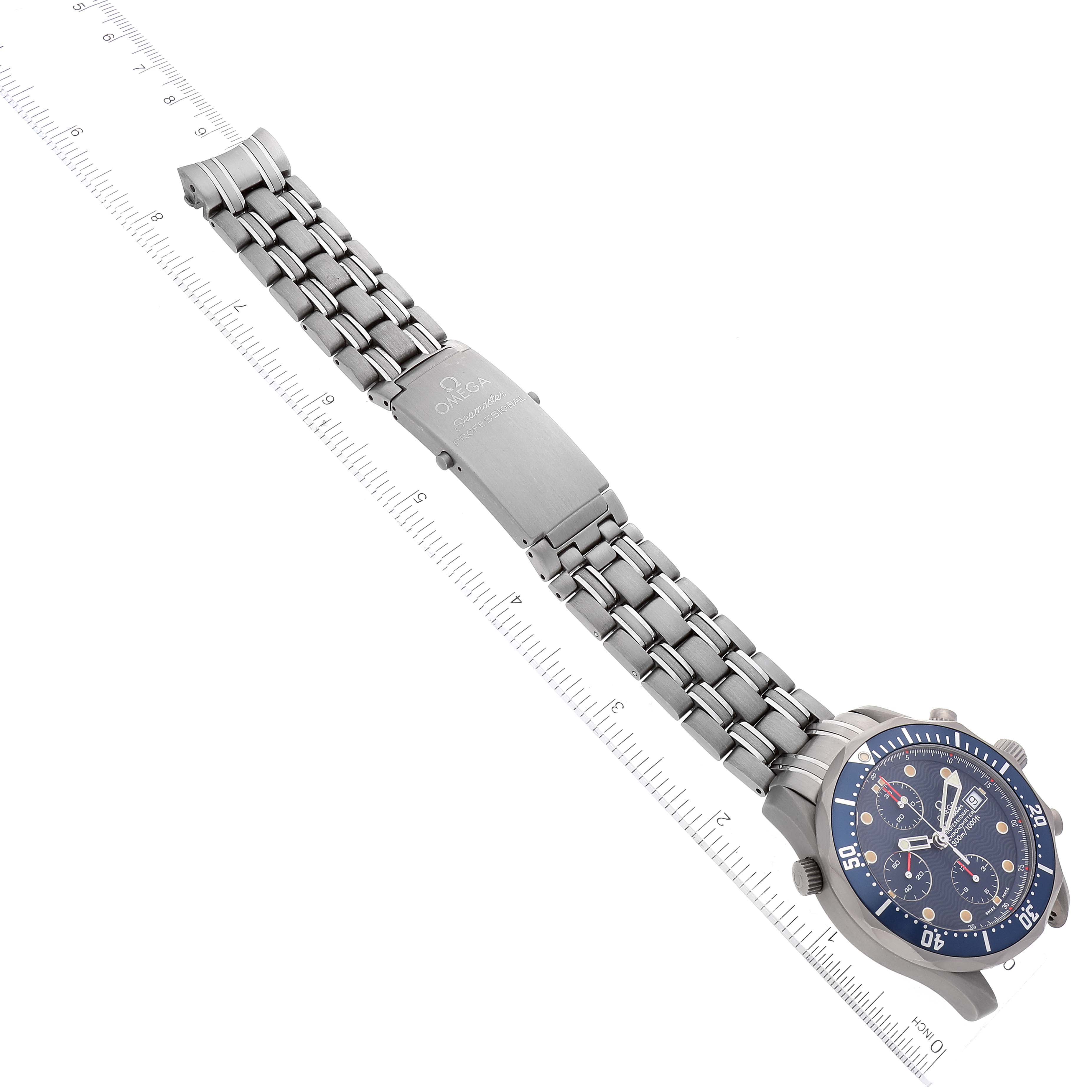 This image shows an Omega Seamaster 2298.80.00 Men's Titanium Blue Dial 2298.80.00 Men's Titanium Blue Dial watch laid flat with a metal bracelet, clasp, and watch face visible, alongside a ruler for scale.