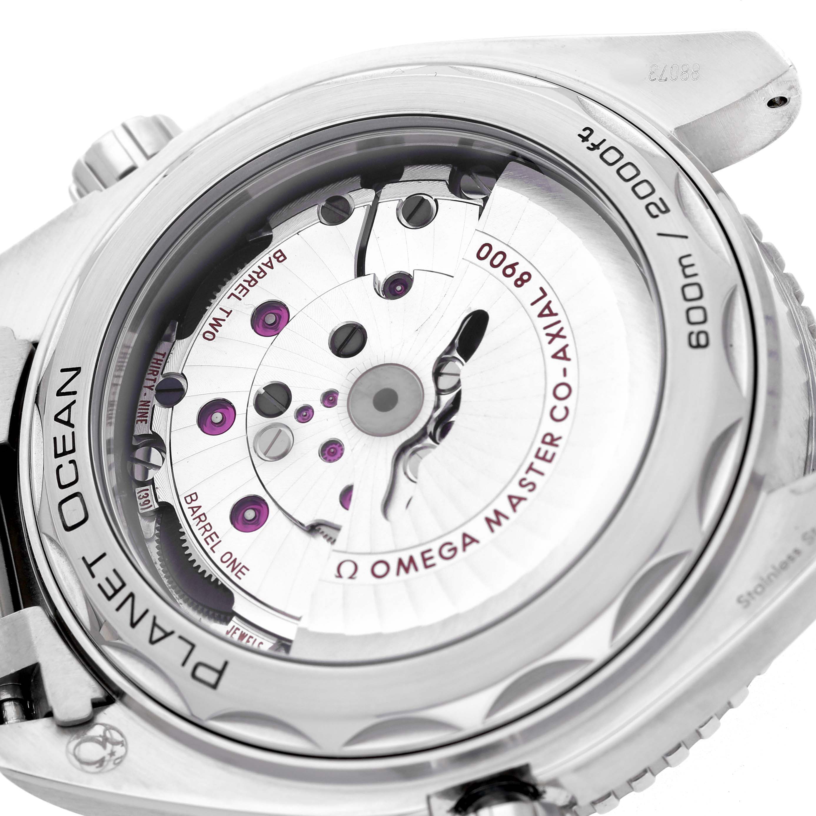 The image shows the back view of the Omega Planet Ocean 215.30.44.21.03.001 Men's Stainless Steel Blue Dial watch, highlighting its transparent case back and Co-Axial movement.