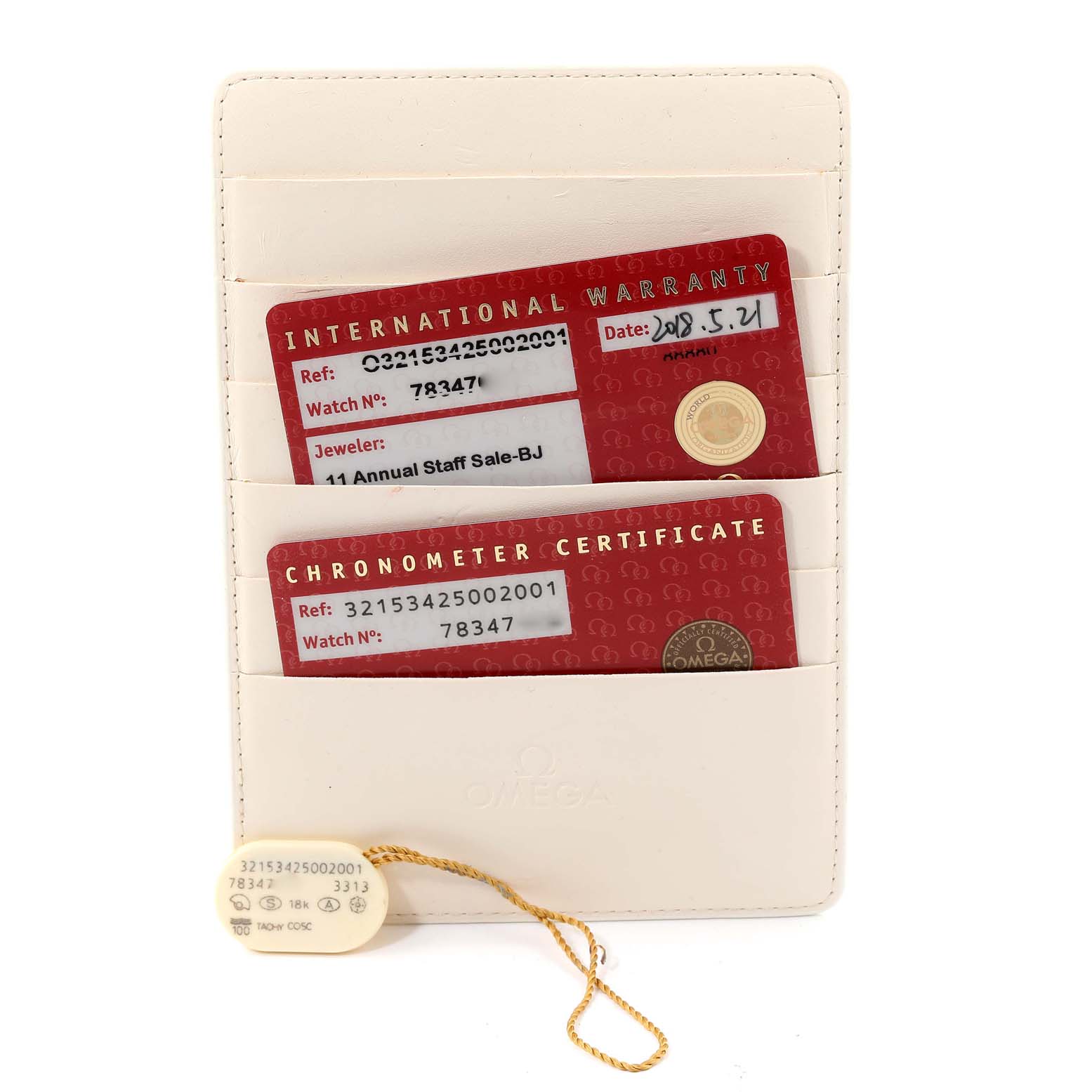 The image shows the warranty cards and chronometer certificate for an Omega Speedmaster 321.53.42.50.02.001 Men's Yellow Gold Silver Dial 321.53.42.50.02.001 Men's Yellow Gold Silver Dial, along with a tag, all inside a cardholder.