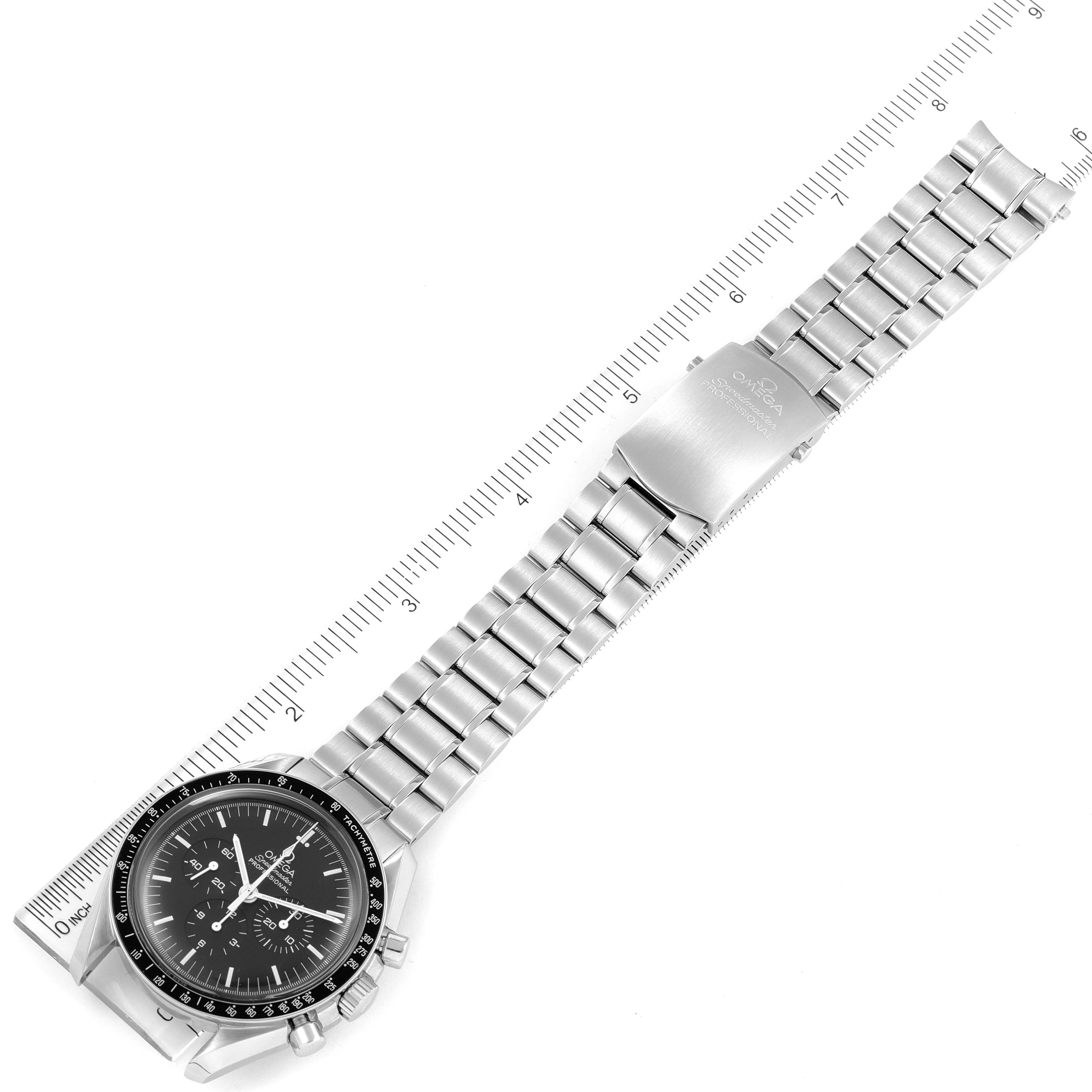 The image shows an Omega Speedmaster 3570.50.00 Men's Stainless Steel Black Dial 3570.50.00 Men's Stainless Steel Black Dial watch laid flat, displaying the face, bracelet, clasp, and ruler for measurement.