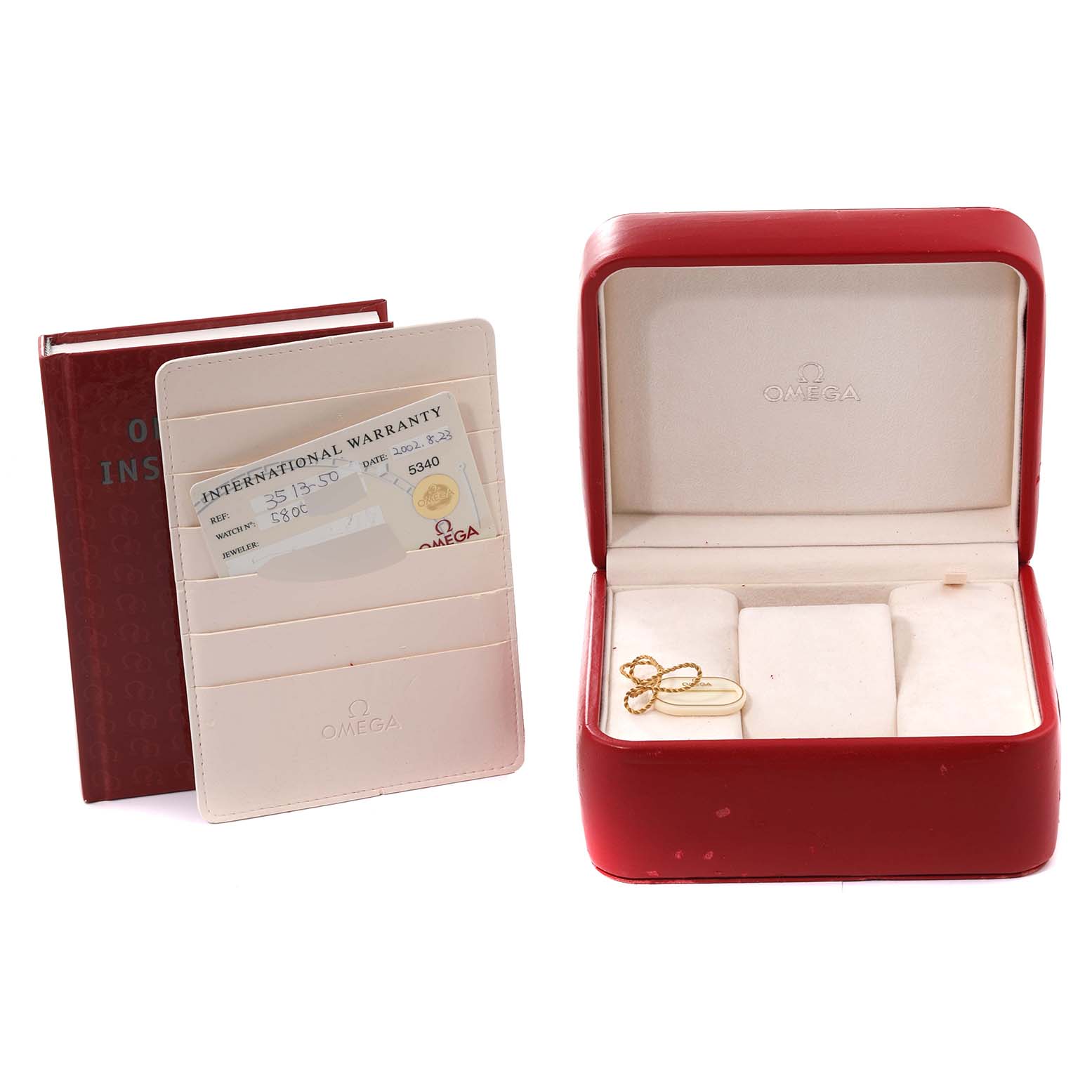 The image shows accessories for an Omega Speedmaster 3513.50.00 Men
s Stainless Steel Black Dial 3513.50.00 Men
s Stainless Steel Black Dial watch, including a box, warranty card, and a red instruction booklet.