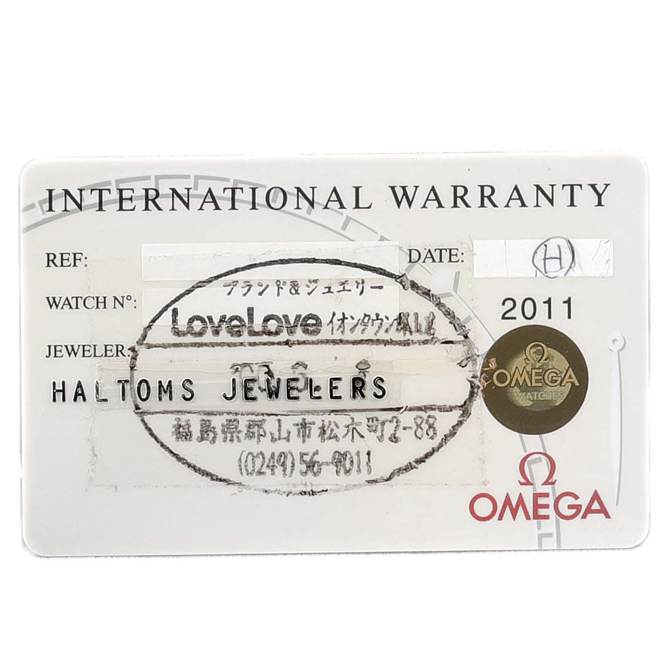 This is an Omega Speedmaster 3572.50.00 Men
s Stainless Steel Black Dial 3572.50.00 Men
s Stainless Steel Black Dial international warranty card, displayed flat, showing details like reference number, date, and jeweler.