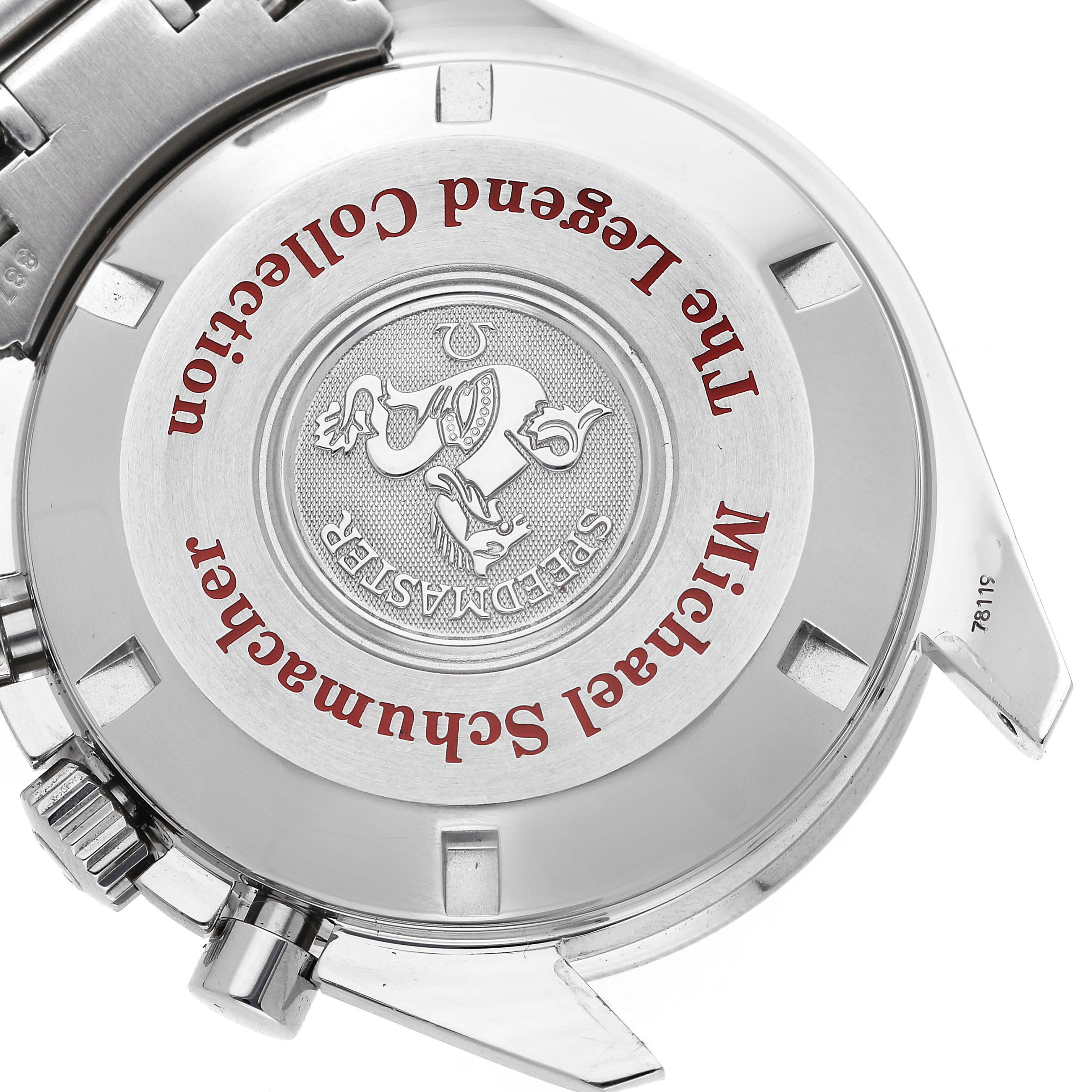 The image shows the case back of the Omega Speedmaster 3506.61.00 Men's Stainless Steel Red Dial, featuring engravings and branding details.