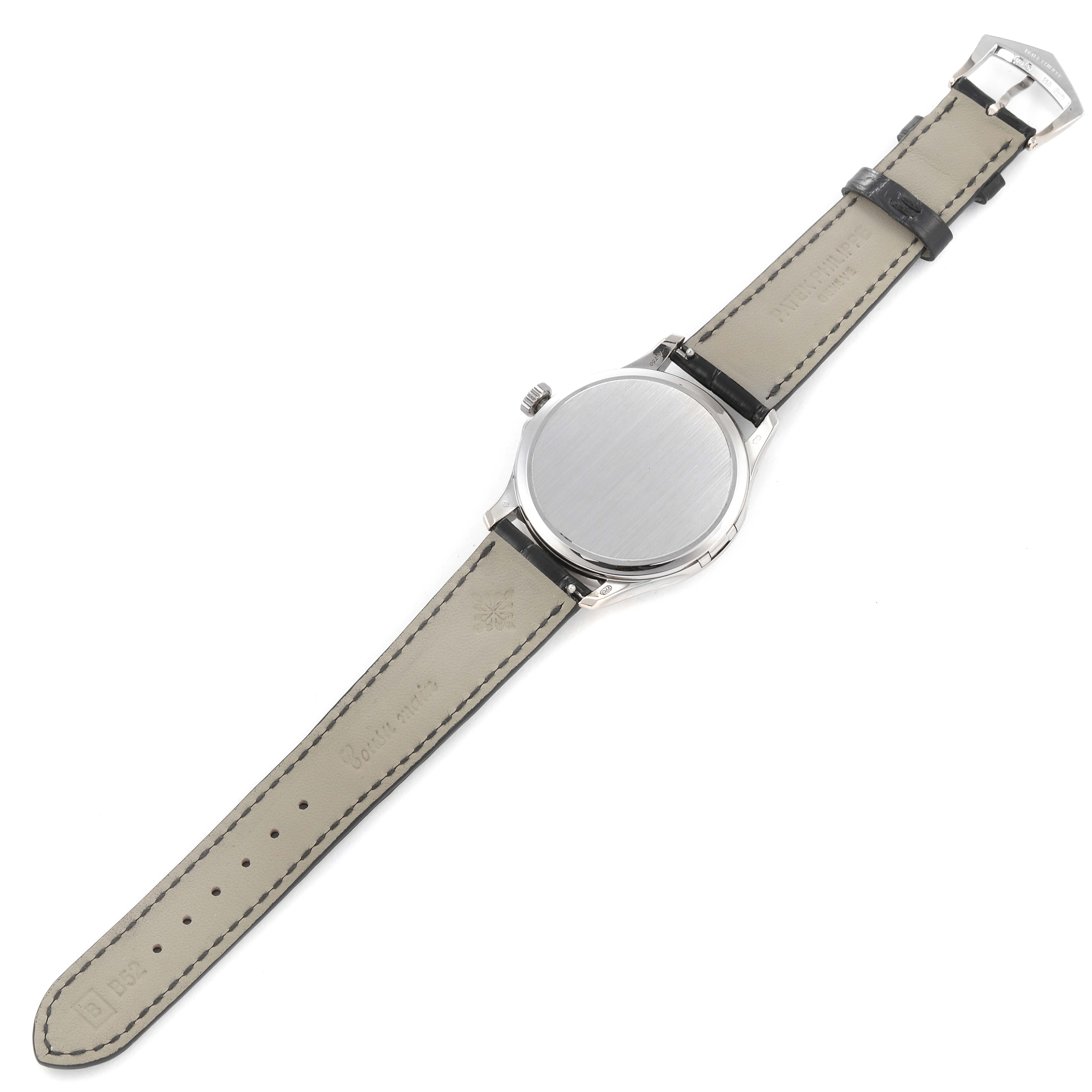 The image shows the back of the Patek Philippe Calatrava 5227G-001 Men's White Gold Beige Dial 5227G-001 Men's White Gold Beige Dial watch laid flat with its leather strap visible.