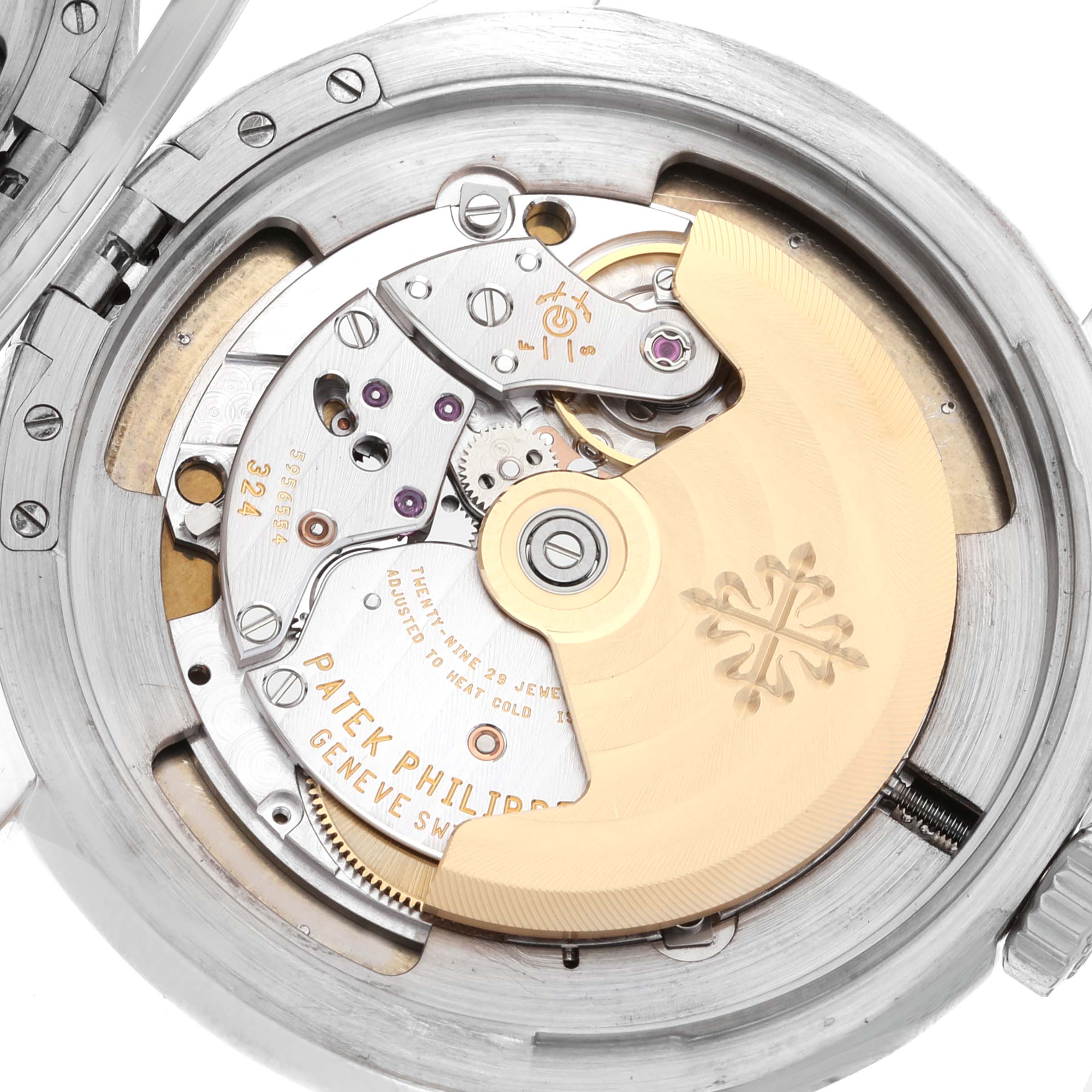 The image shows a detailed view of the movement and inner mechanism of a Patek Philippe Calatrava 5227G-001 Men's White Gold Beige Dial 5227G-001 Men's White Gold Beige Dial watch.