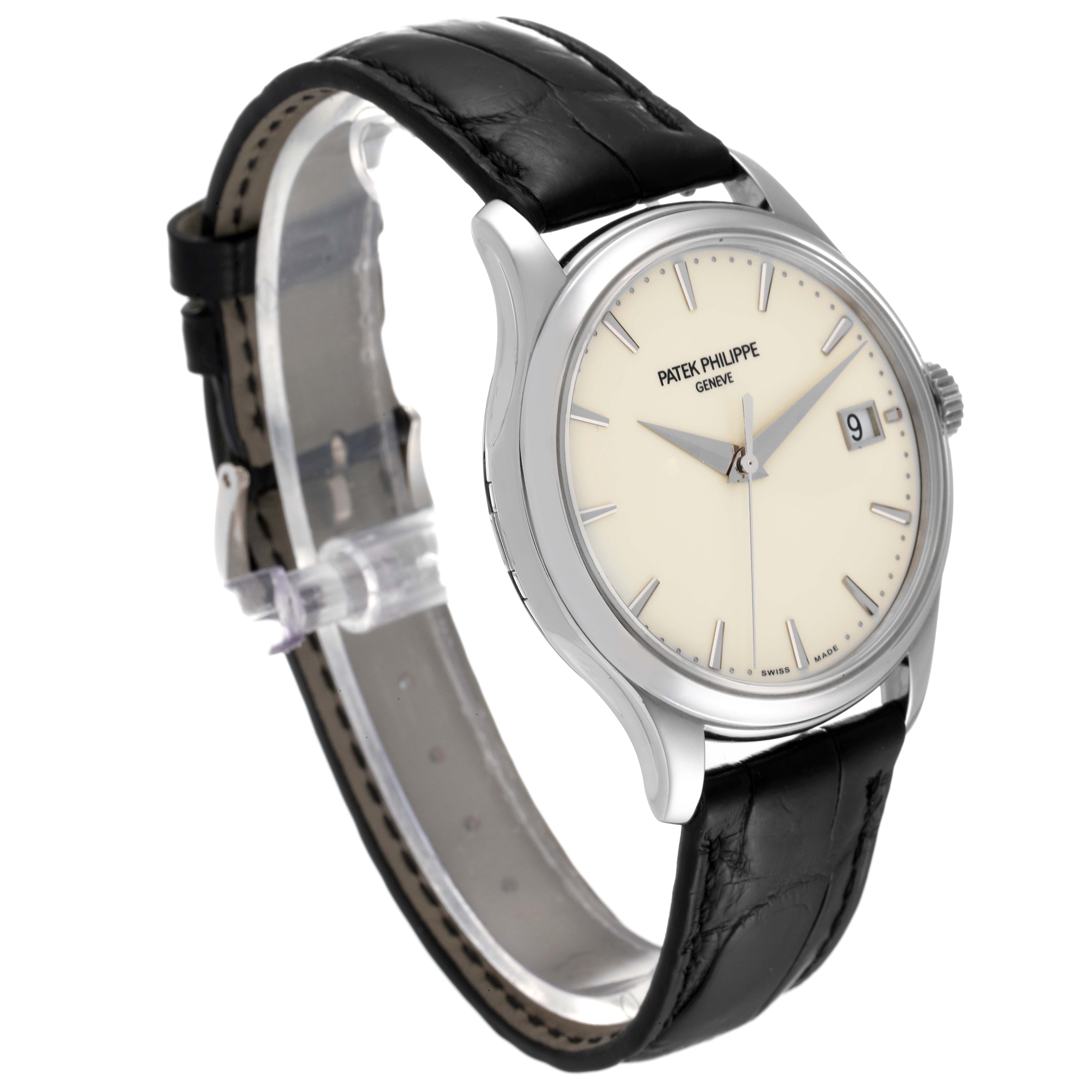 The image shows a side-angled view of a Patek Philippe Calatrava 5227G-001 Men's White Gold Beige Dial 5227G-001 Men's White Gold Beige Dial watch, highlighting its dial, case, crown, and black leather strap.