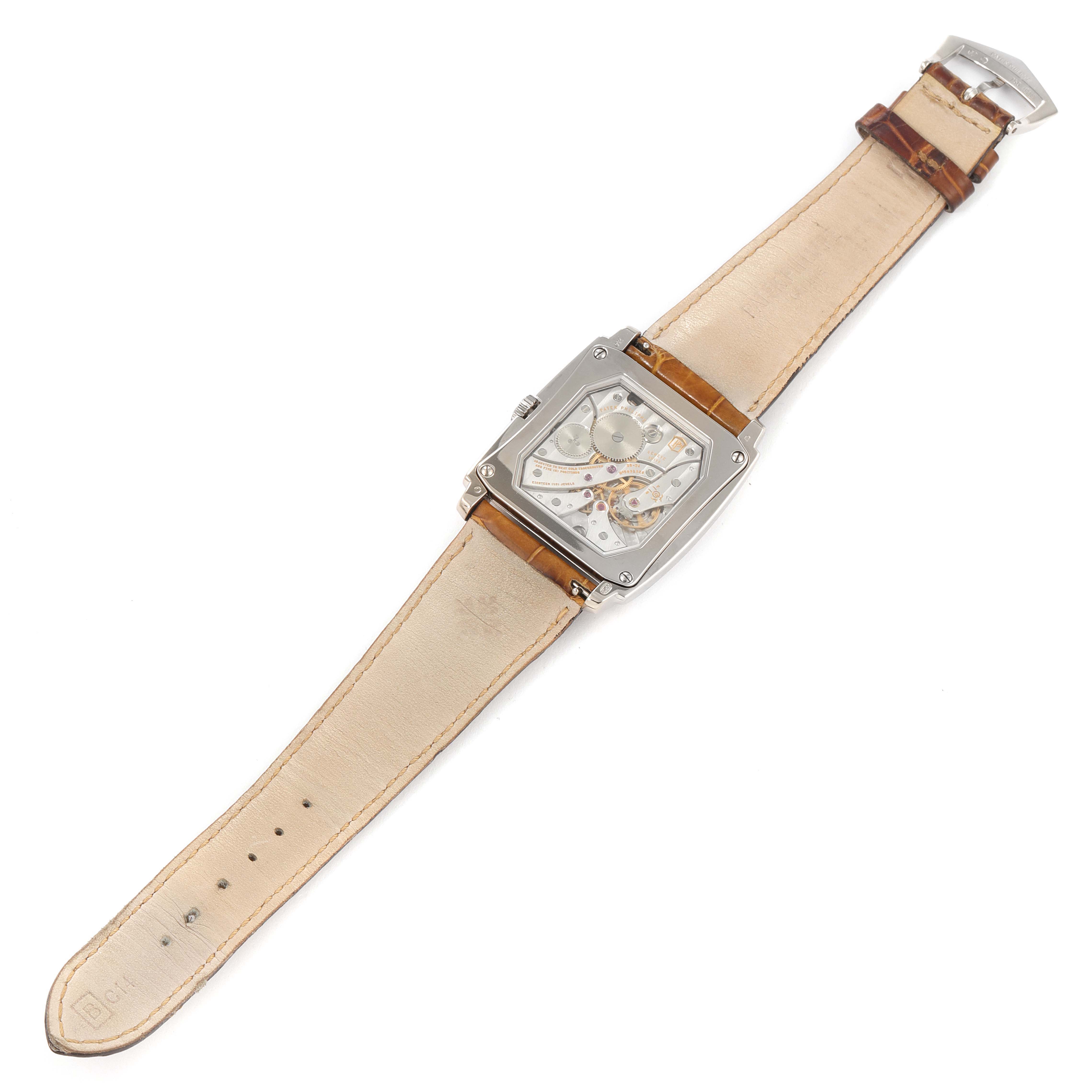 The image shows a Patek Philippe Gondolo 5124G-001 Men's White Gold Pink Dial 5124G-001 Men's White Gold Pink Dial watch from the back, highlighting the transparent case back and leather strap.