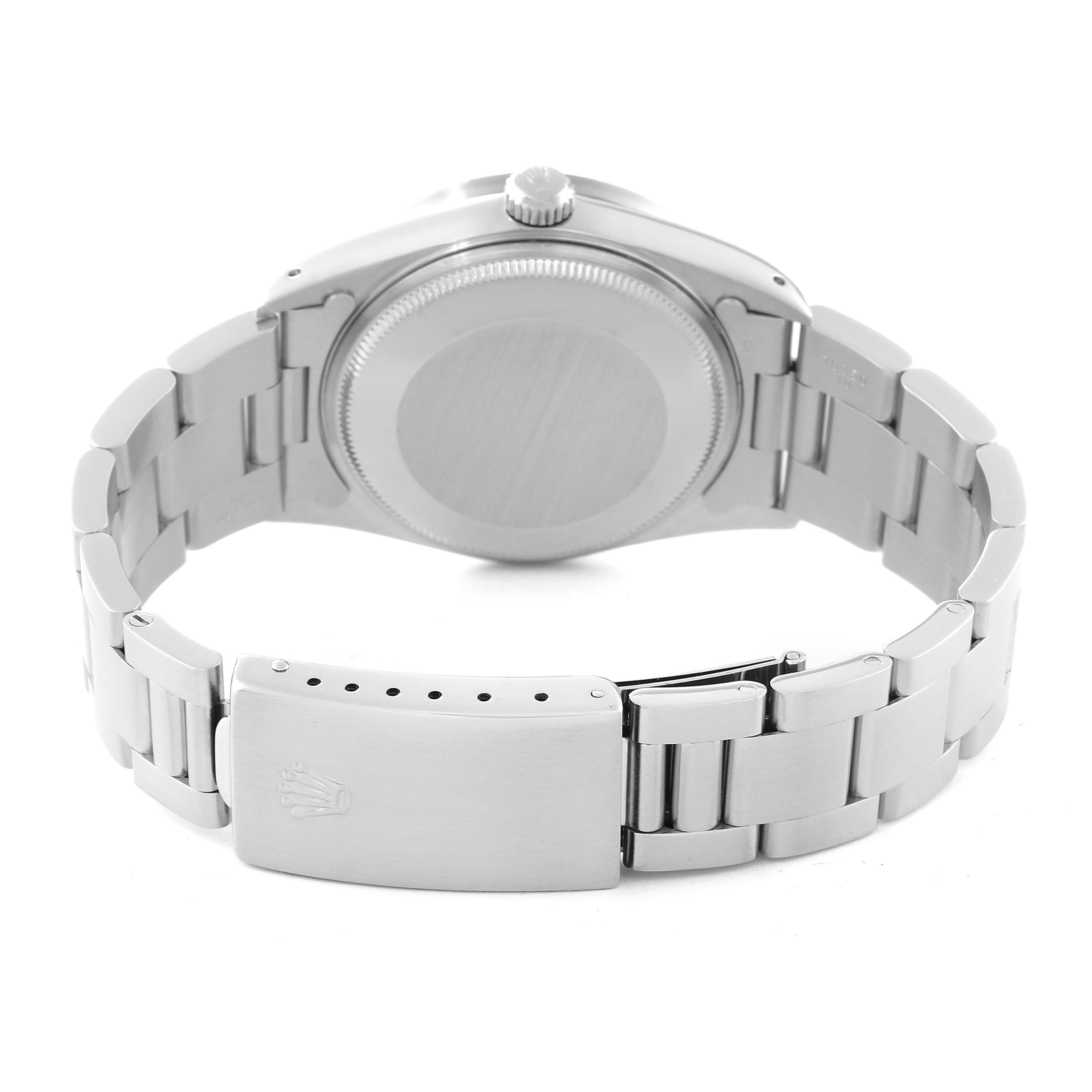 This image shows the back of a Rolex Air-King 14010 Men's Stainless Steel Blue Dial 14010 Men's Stainless Steel Blue Dial watch, including the case back and the bracelet with the clasp.