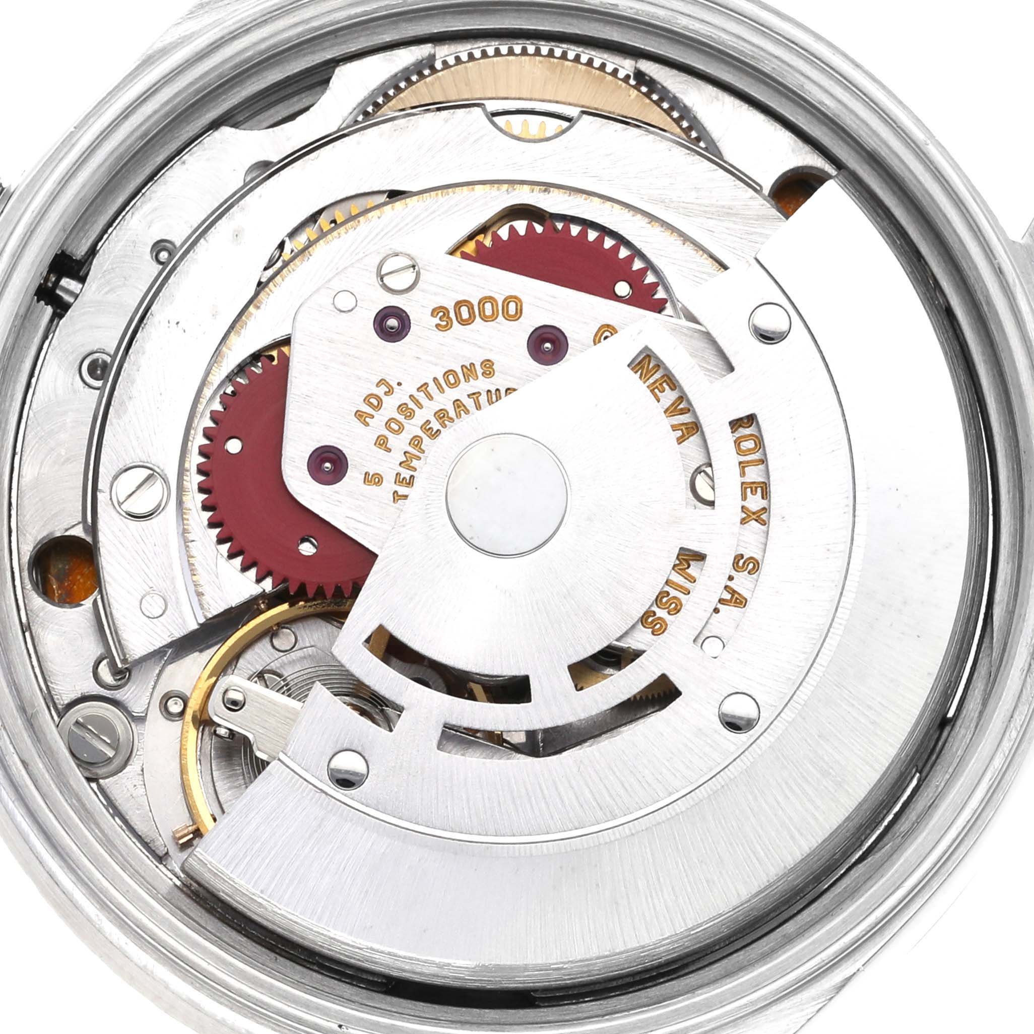 The image shows an internal view of the Rolex Air-King 14010 Men's Stainless Steel Blue Dial 14010 Men's Stainless Steel Blue Dial watch, highlighting its intricate movement and mechanical components.