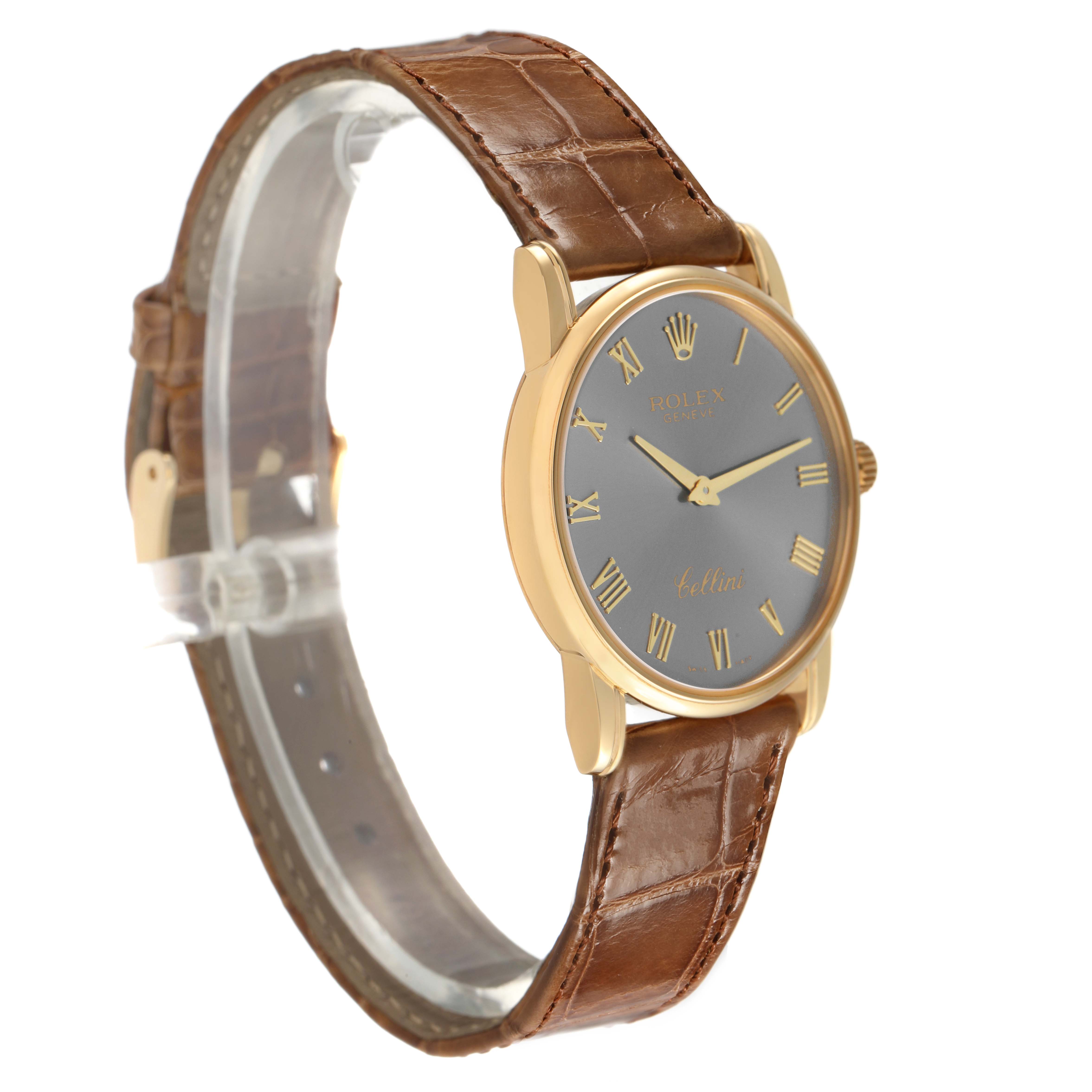 The Rolex Cellini 5116 Men's Yellow Gold Grey Dial watch is shown at a tilted angle, displaying the dial, brown leather strap, and gold case.