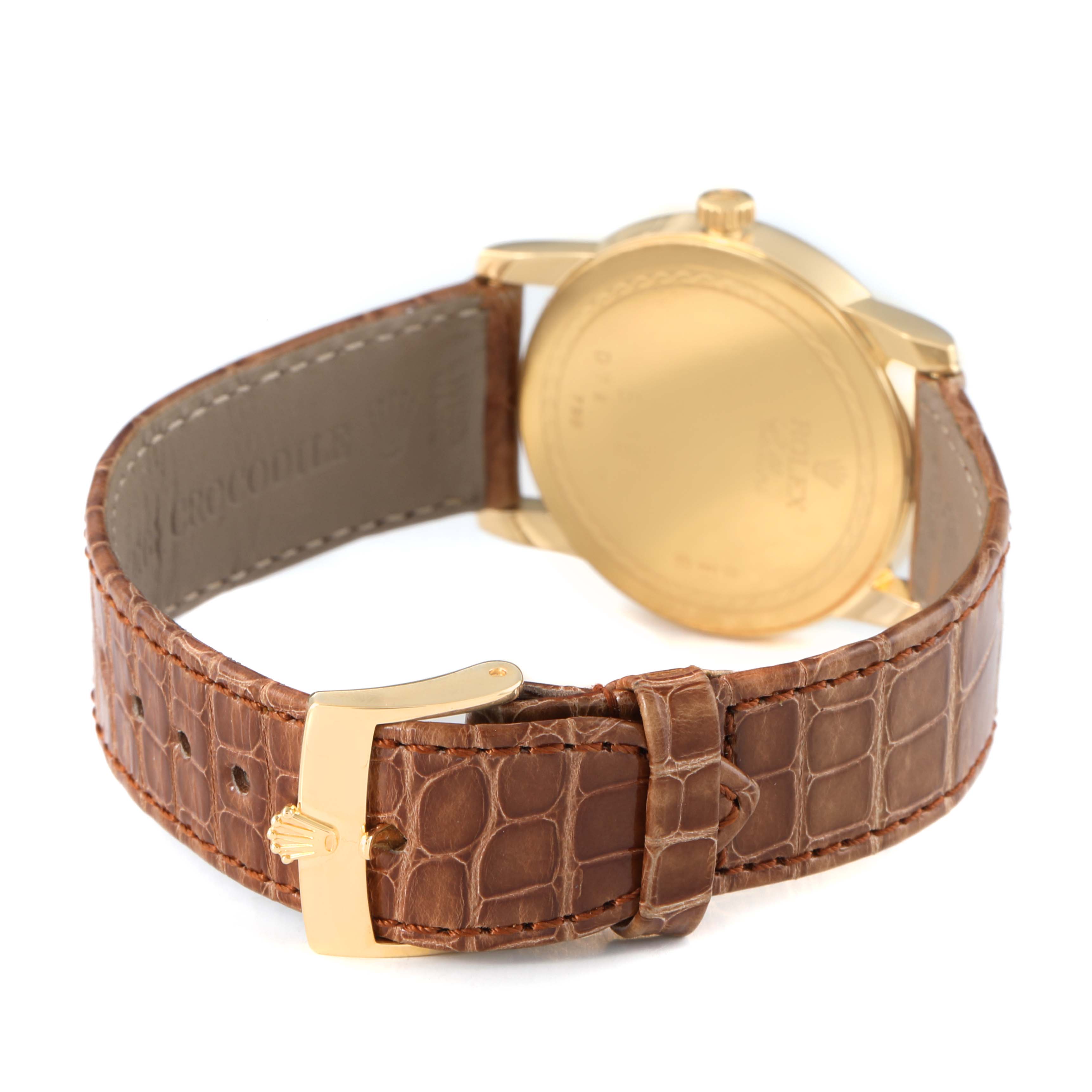 The image shows the back of a Rolex Cellini 5116 Men's Yellow Gold Grey Dial watch, highlighting the gold case, brown crocodile leather strap, and buckle.