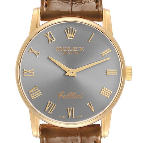 The Rolex Cellini 5116 Men's Yellow Gold Grey Dial watch is shown from a front angle, highlighting the dial, crown, and brown leather strap attachment.