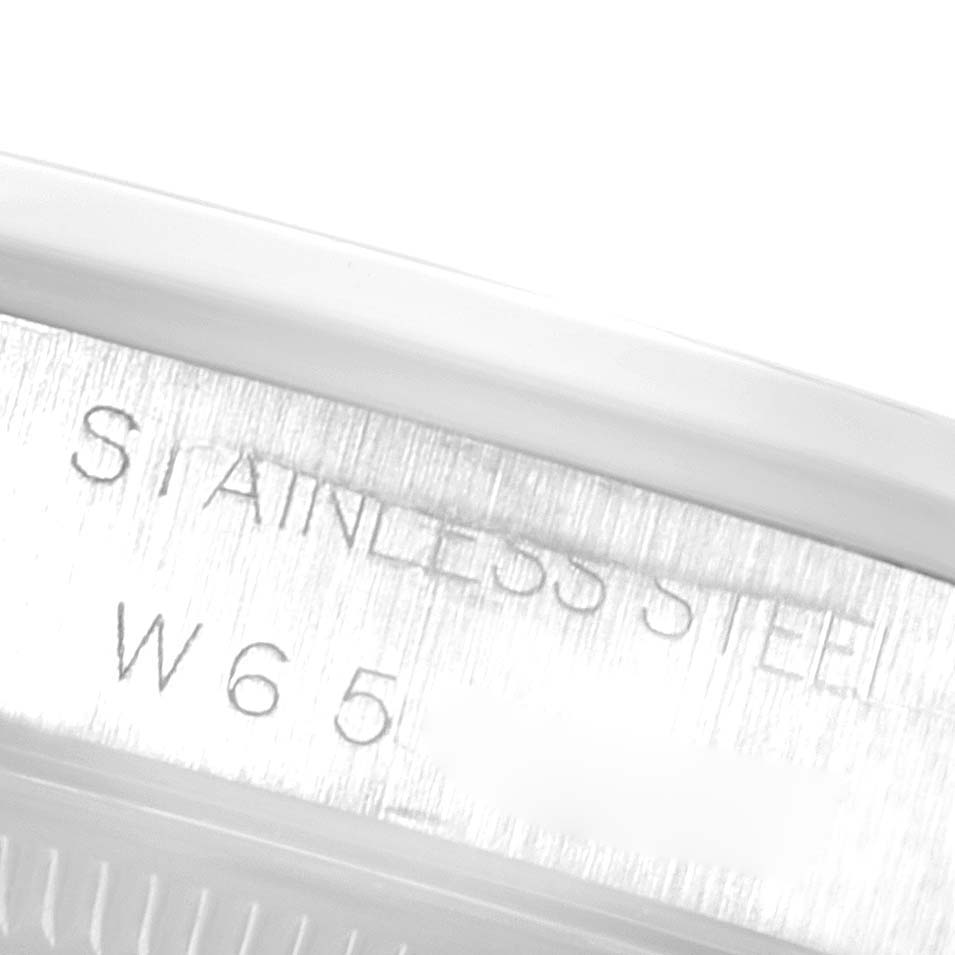 This close-up image shows the engraving on the stainless steel case of a Rolex Date 15200 Men's Stainless Steel Silver Dial 15200 Men's Stainless Steel Silver Dial model watch.