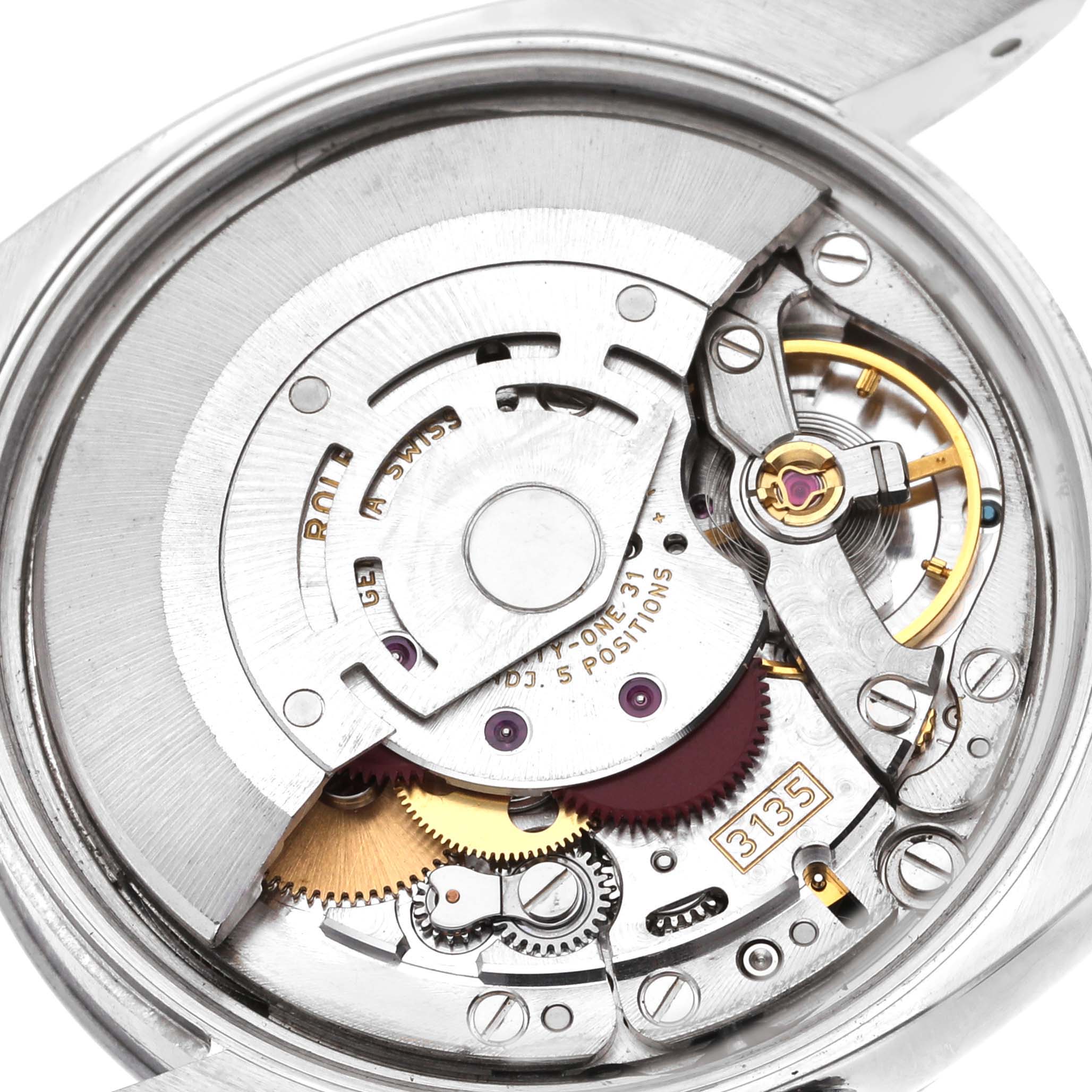 The image shows the internal mechanical components of the Rolex Date 115210 Men's Stainless Steel Blue Dial 115210 Men's Stainless Steel Blue Dial model watch from a close-up, top-down angle.