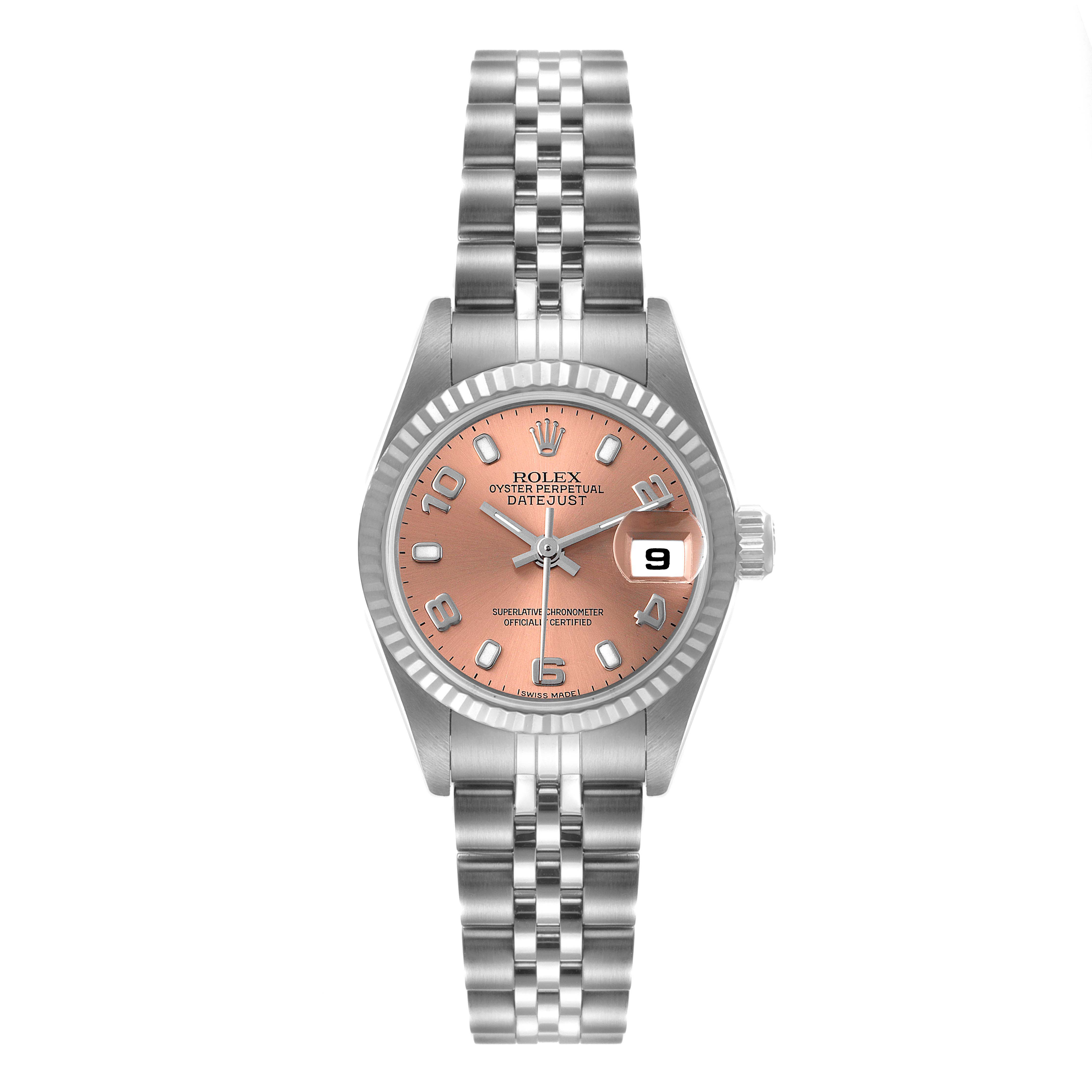 The Rolex Datejust 79174 Women's Stainless Steel Pink Dial 79174 Women's Stainless Steel Pink Dial watch is shown from a frontal angle, displaying its peach dial, jubilee bracelet, and date window at 3 o'clock.