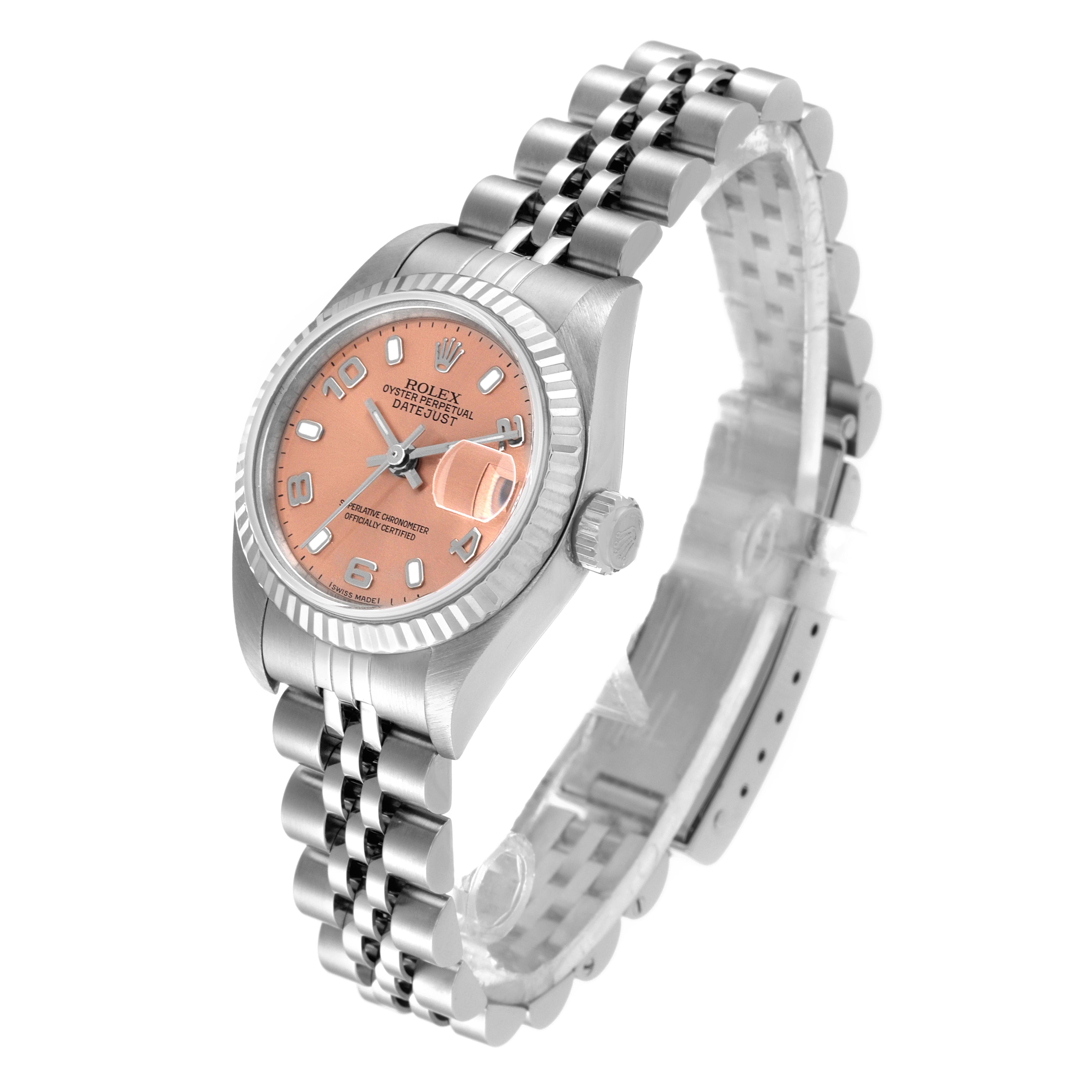 The Rolex Datejust 79174 Women's Stainless Steel Pink Dial 79174 Women's Stainless Steel Pink Dial watch is shown at an angled view, highlighting its face, crown, and jubilee bracelet.