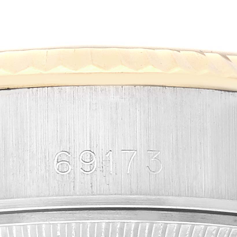 This close-up image shows the model number engraving (69173) and part of the bezel of a Rolex Datejust 69173 Women's Steel and Gold (two tone) Black Dial 69173 Women's Steel and Gold (two tone) Black Dial watch.