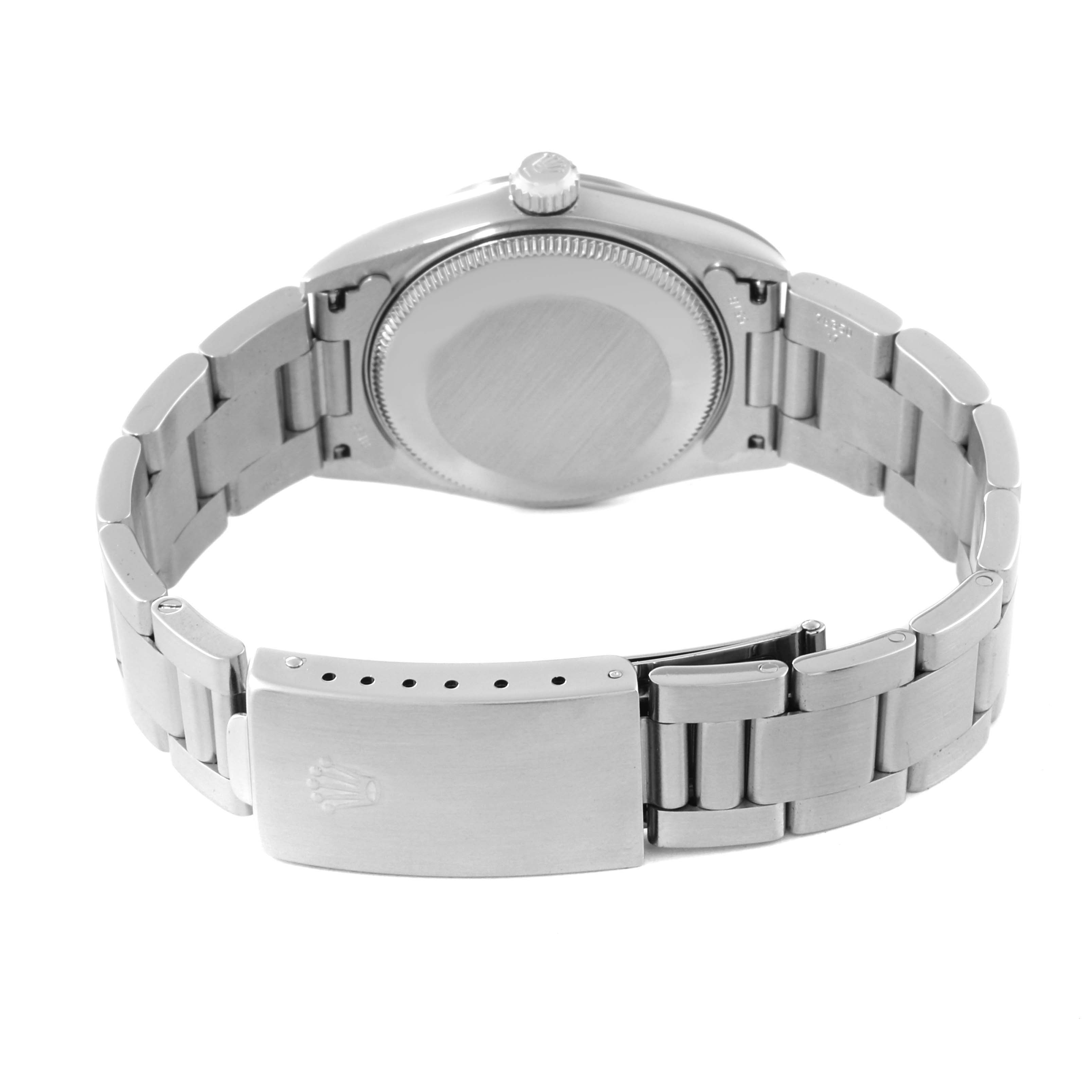 The image shows the back view of a Rolex Mid-Size 78240 Women's Stainless Steel Pink Dial 78240 Women's Stainless Steel Pink Dial watch, highlighting the case back and metal bracelet with the clasp open.