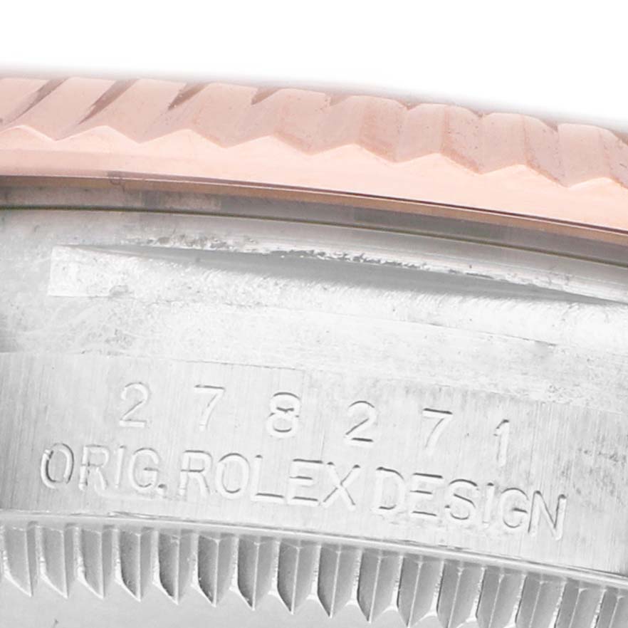 The image shows a close-up of the bezel and engraved side of a Rolex Mid-Size 278271 Women's Steel and Gold (two tone) Silver Dial watch, highlighting the fluted edge and model number.