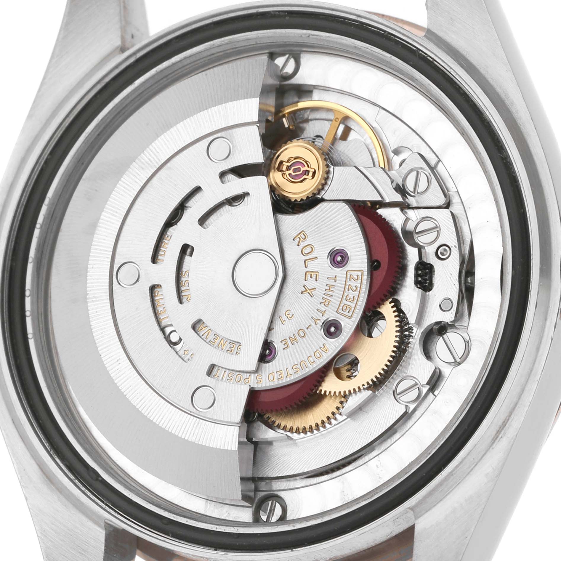 The image shows the back view of a Rolex Mid-Size 278271 Women's Steel and Gold (two tone) Silver Dial model, revealing its internal movement components.