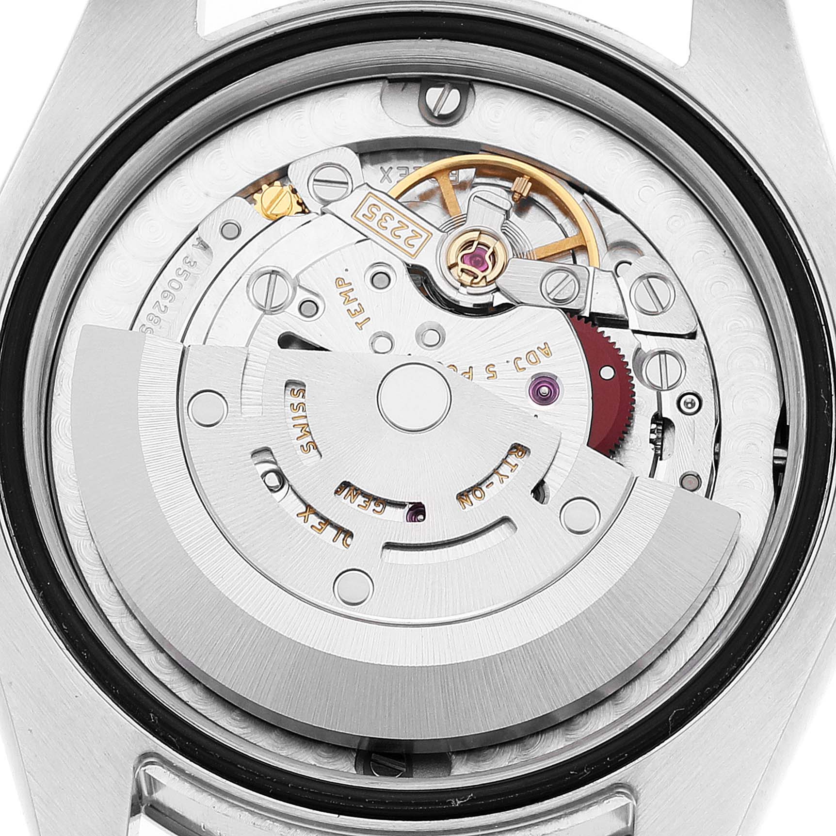 The image shows a close-up of the movement mechanism of a Mid-Size Rolex watch from the back.