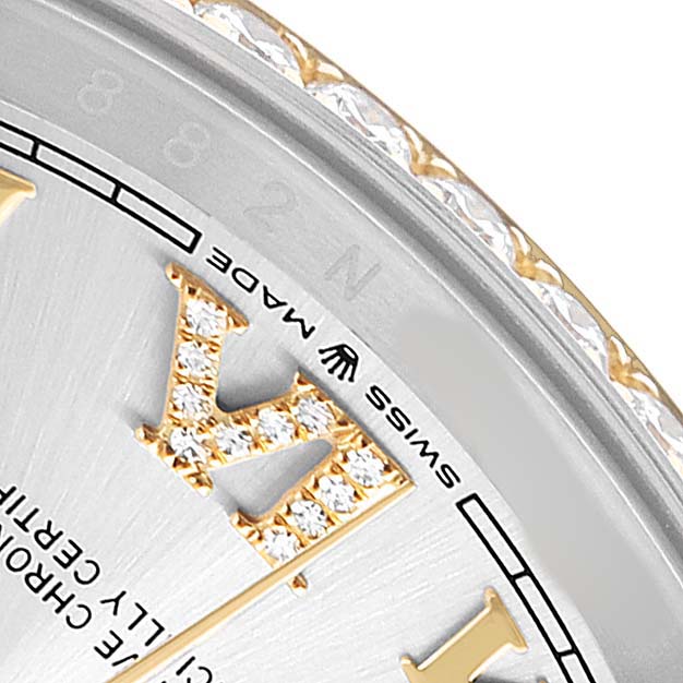 The image shows part of a Rolex Datejust 126283 Men's Steel and Gold (two tone) Silver Dial watch featuring a diamond-encrusted Roman numeral and part of the bezel.