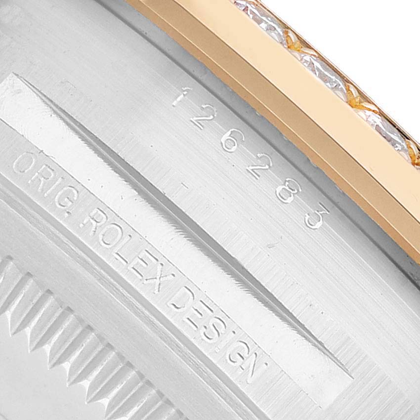 The image shows a close-up of the side and back of a Rolex Datejust 126283 Men's Steel and Gold (two tone) Silver Dial, highlighting the engraving details.