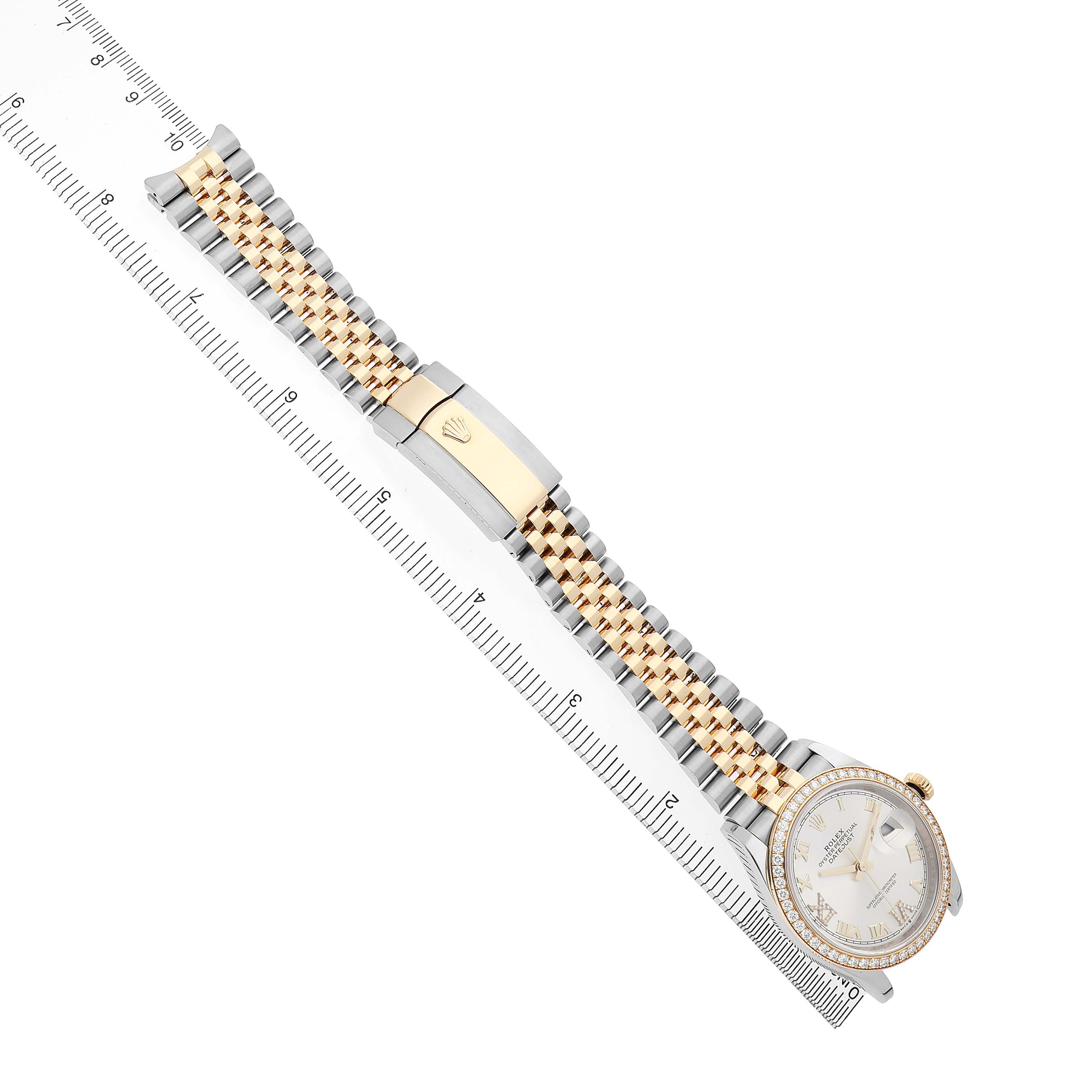 The image shows a Rolex Datejust 126283 Men's Steel and Gold (two tone) Silver Dial watch at a diagonal angle, highlighting the band, clasp, and face with a ruler for scale.