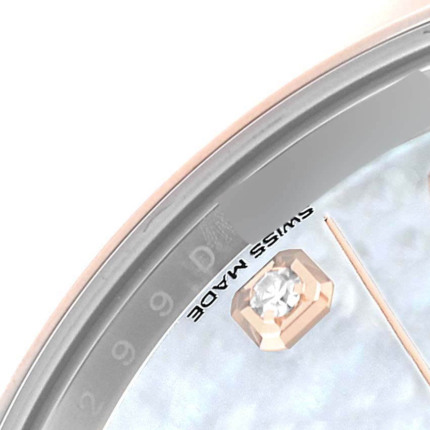 The image shows a close-up of the dial edge of a Rolex Datejust 41 126301 Men's Steel and Gold (two tone) Mother of Pearl Dial, highlighting the "Swiss Made" text and a diamond hour marker.