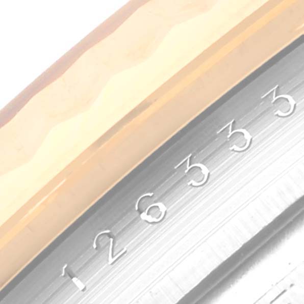 This image shows a close-up of the bezel and part of the serial number on the Rolex Datejust 41 126333 Men's Steel and Gold (two tone) Silver Dial 126333 Men's Steel and Gold (two tone) Silver Dial model.