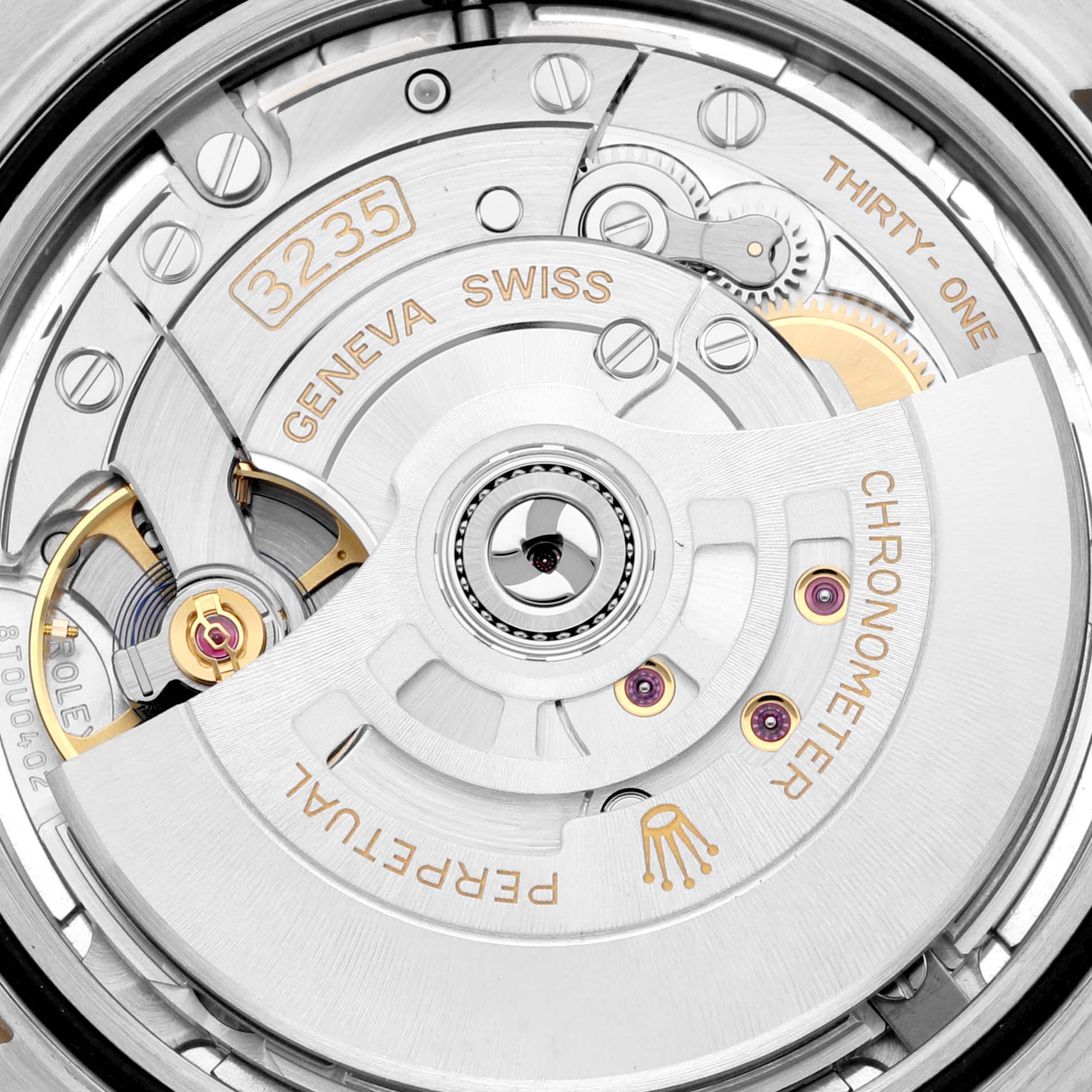 This image shows a close-up view of the movement mechanism of a Rolex Datejust 41 126333 Men's Steel and Gold (two tone) Silver Dial 126333 Men's Steel and Gold (two tone) Silver Dial, highlighting the Geneva Swiss 3235 caliber.