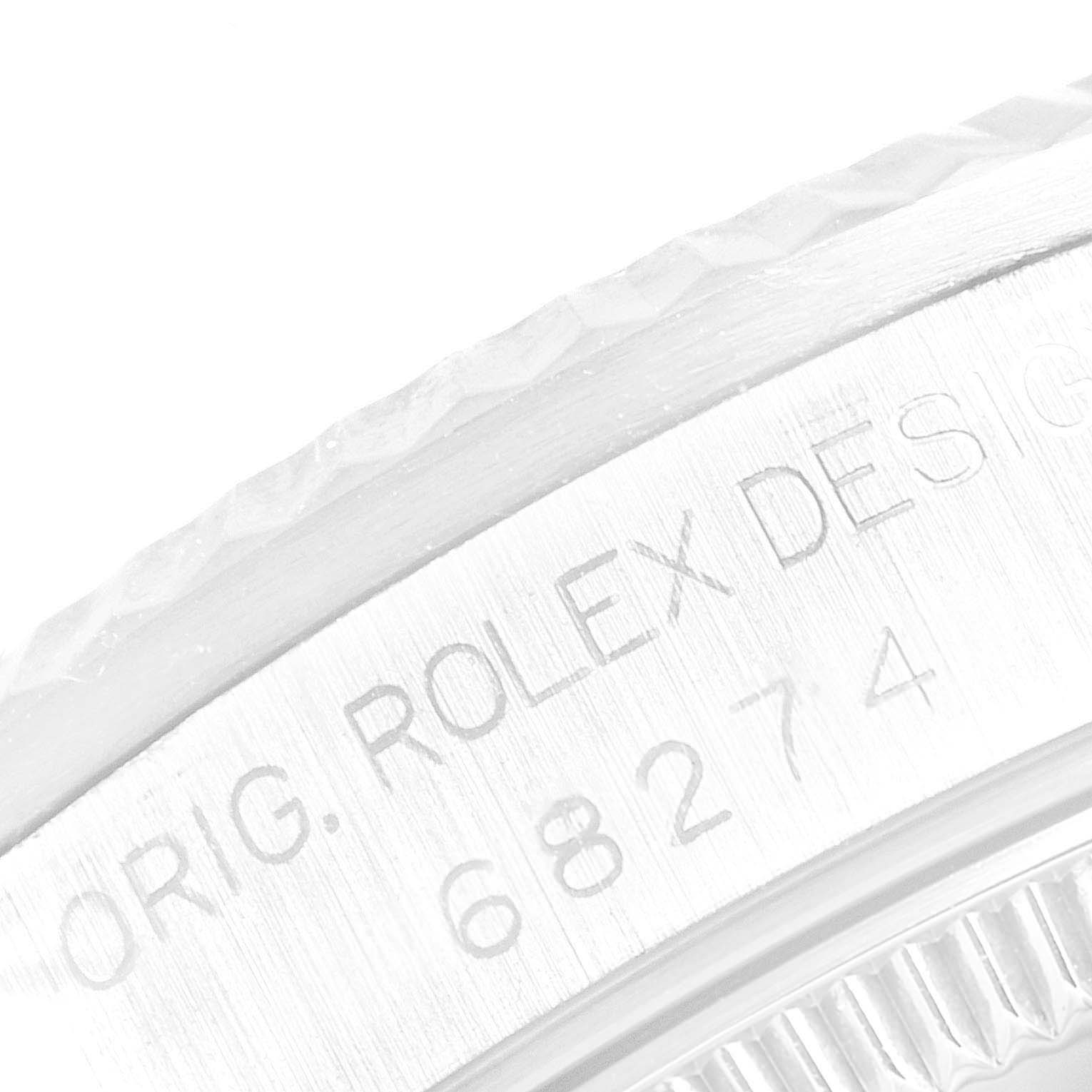 This is a close-up angle showing the engraved model number "68274" and brand name "Rolex" on the case of a Mid-Size Rolex watch.